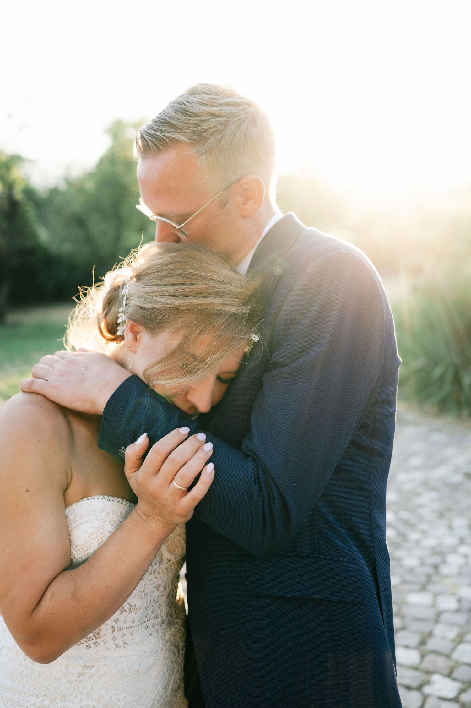 Romantic sunset wedding portraits showing intimate moments between newlyweds.