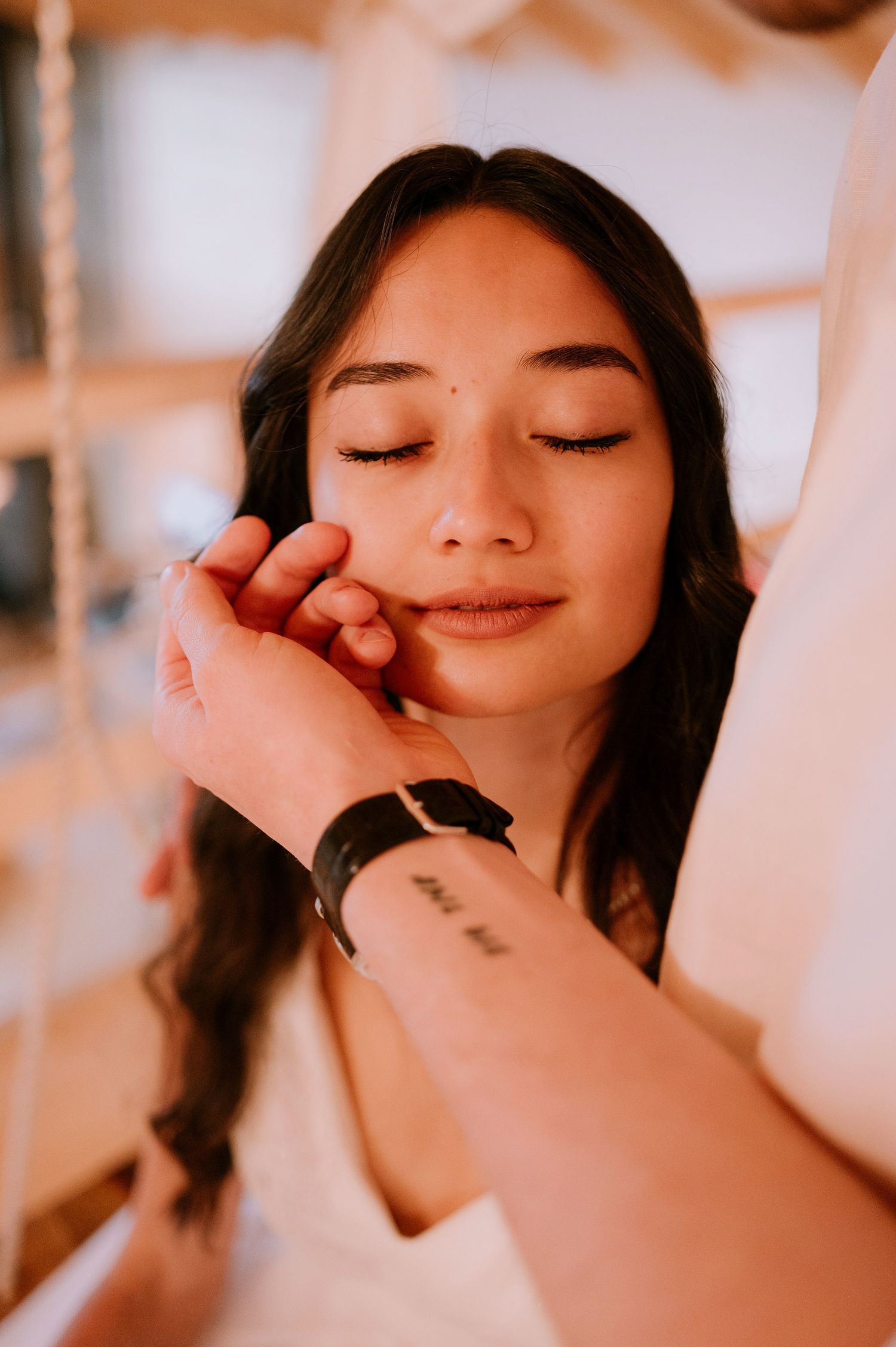 Artistic close-up portrait with soft romantic lighting and natural makeup.