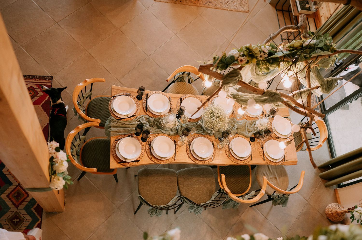 Decorative hanging lights create an elegant ambiance in a wedding reception venue.