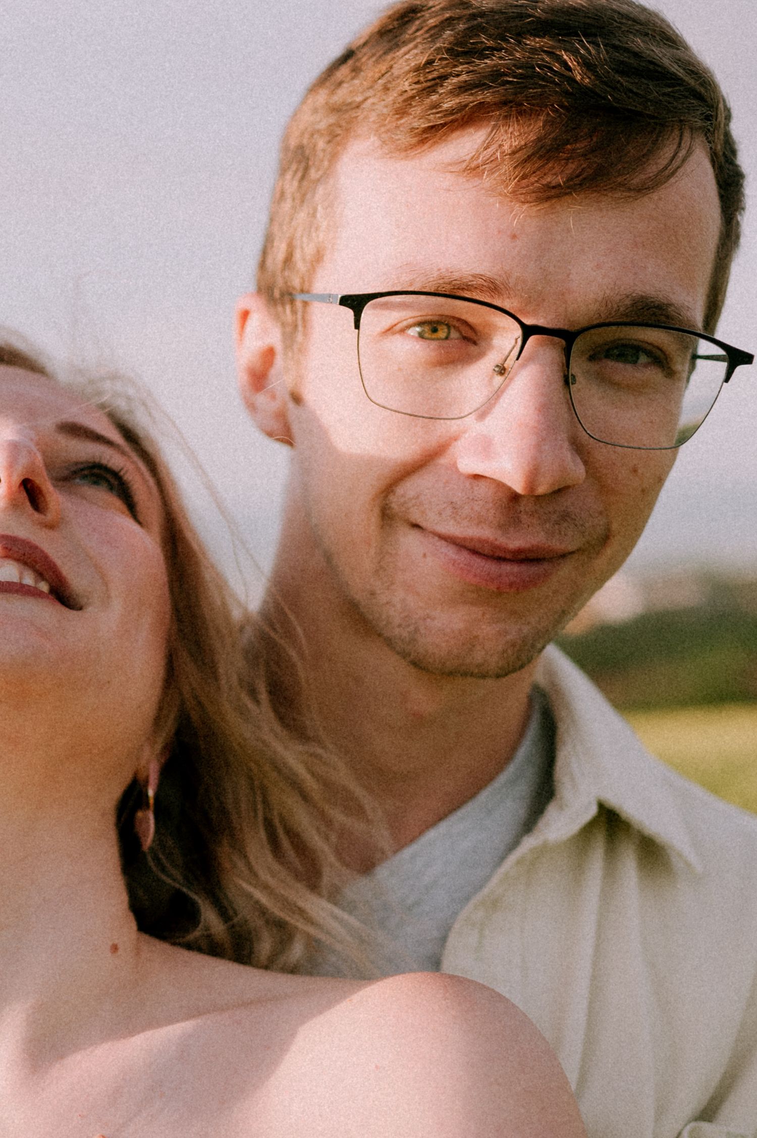 A romantic close-up sequence showing tender moments between a couple against a soft background.