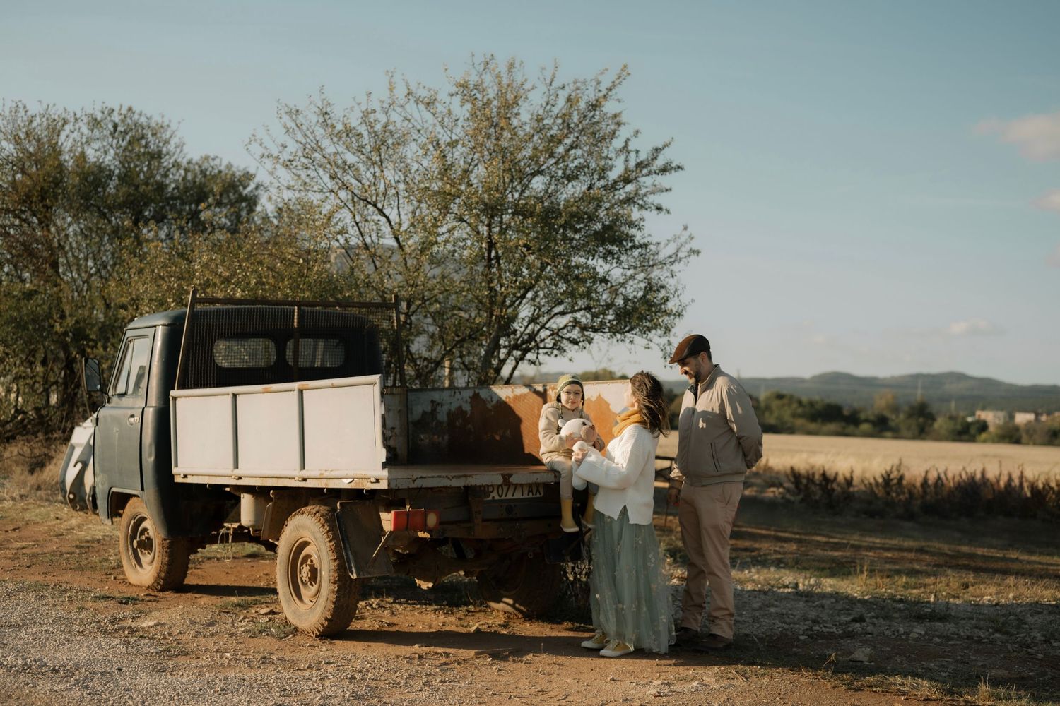 A romantic desert engagement session with a vintage truck and couple at golden hour in the Arizona wilderness.
