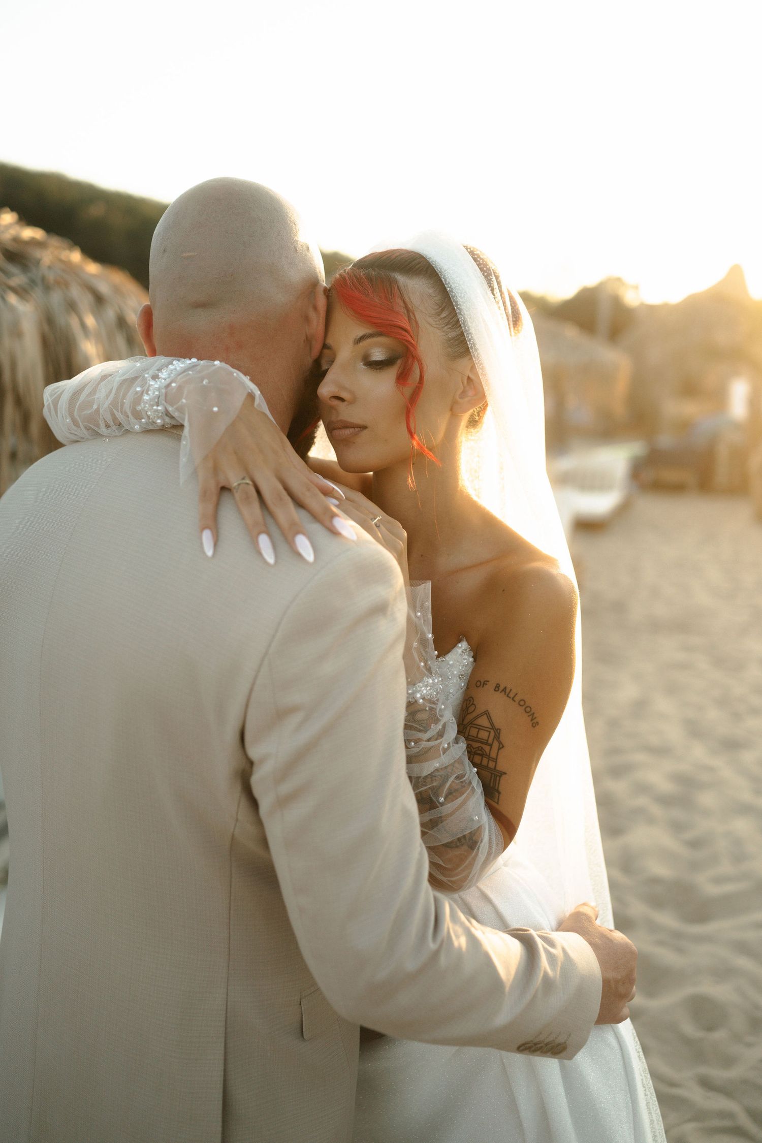 A romantic beach wedding photoshoot sequence showing intimate moments between newlyweds at sunset.