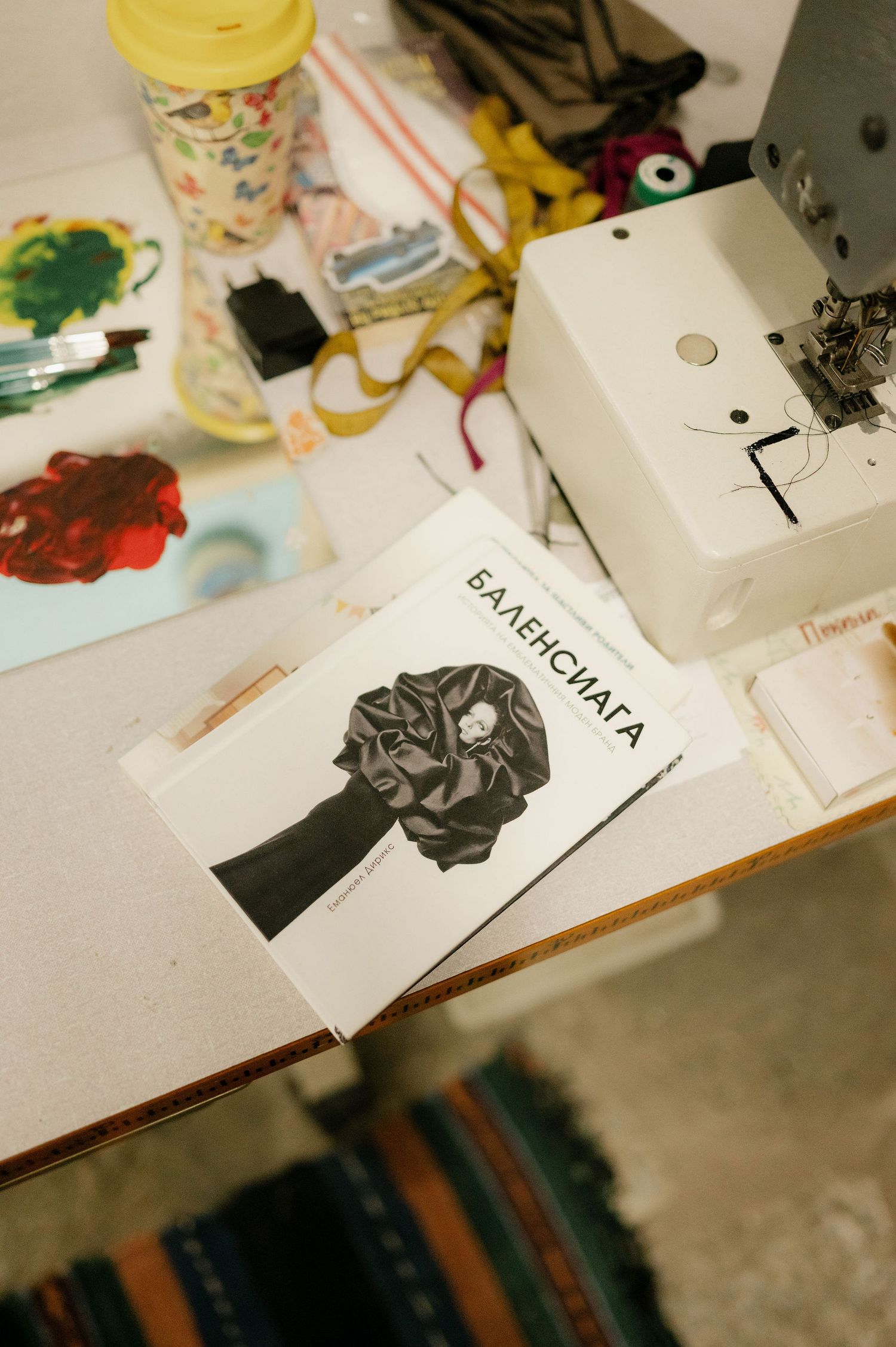 Artistic sketches and drawings laid out on a white surface showing creative design process.