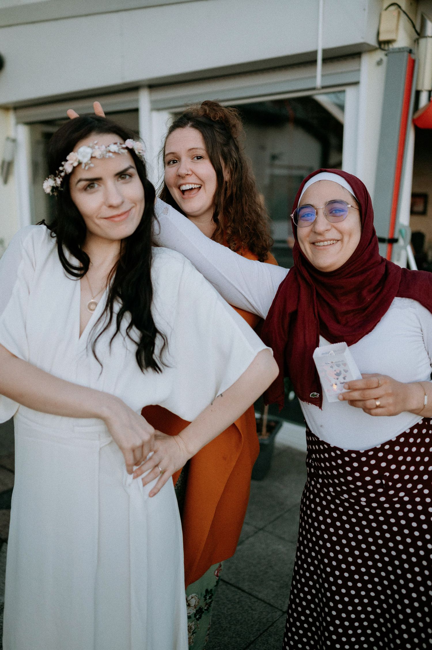 Two people embrace and laugh together during wedding celebration photoshoot.