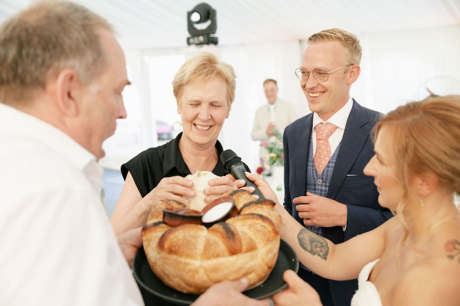 Wedding guests enjoy refreshments and conversation at an elegant reception.