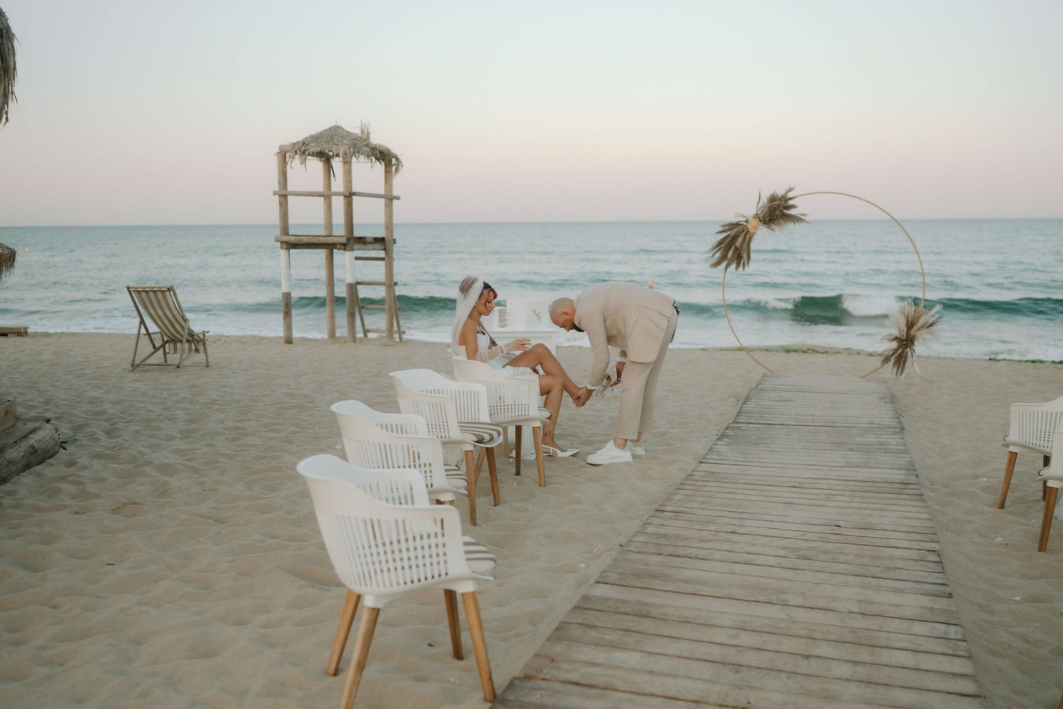 A series of beach scenes showing wooden walkways, chairs, and ocean views in soft, muted tones.