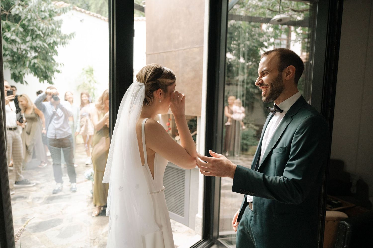 A sequence of wedding moments captured in an elegant indoor venue with natural lighting.