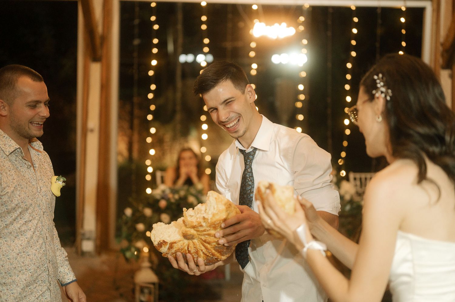 A wedding reception montage showing couples dancing and celebrating with string lights glowing in the background.