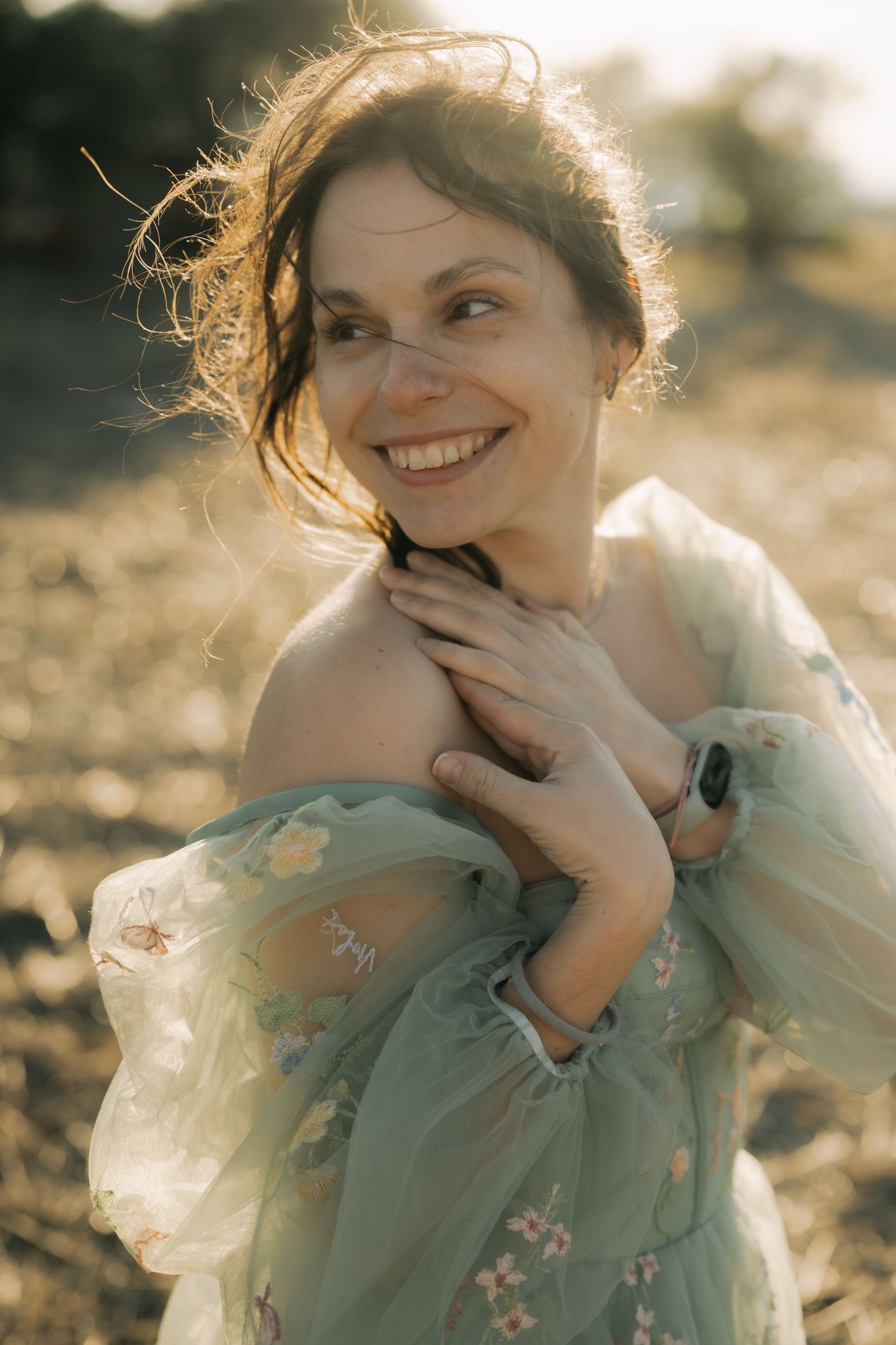 A series of dreamy portrait photos in warm sunlight showing someone in a mint green floral dress with backlit hair.