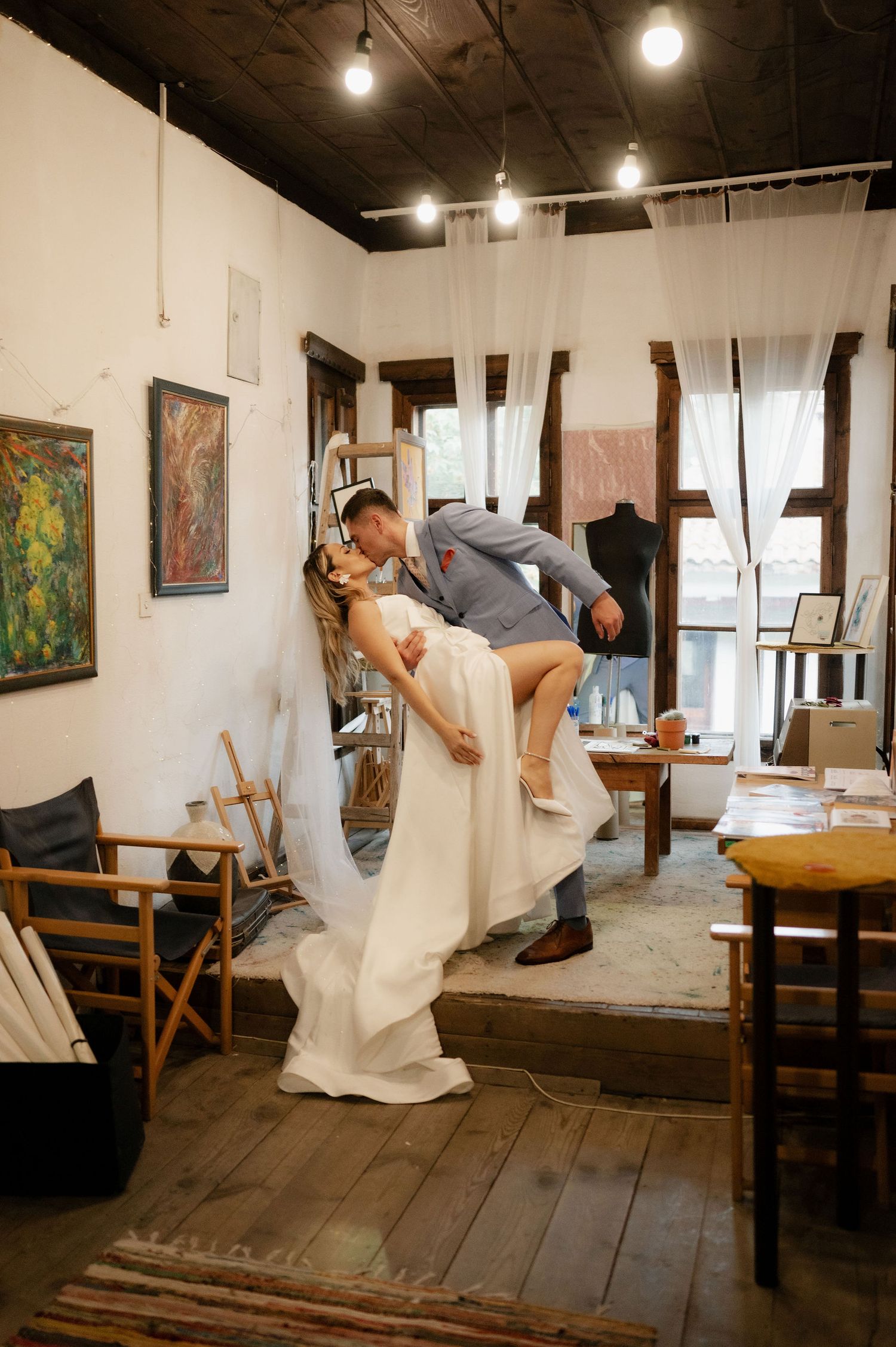 A series of artistic dance poses captured in sequence showing graceful movement in a gallery space with wooden floors.