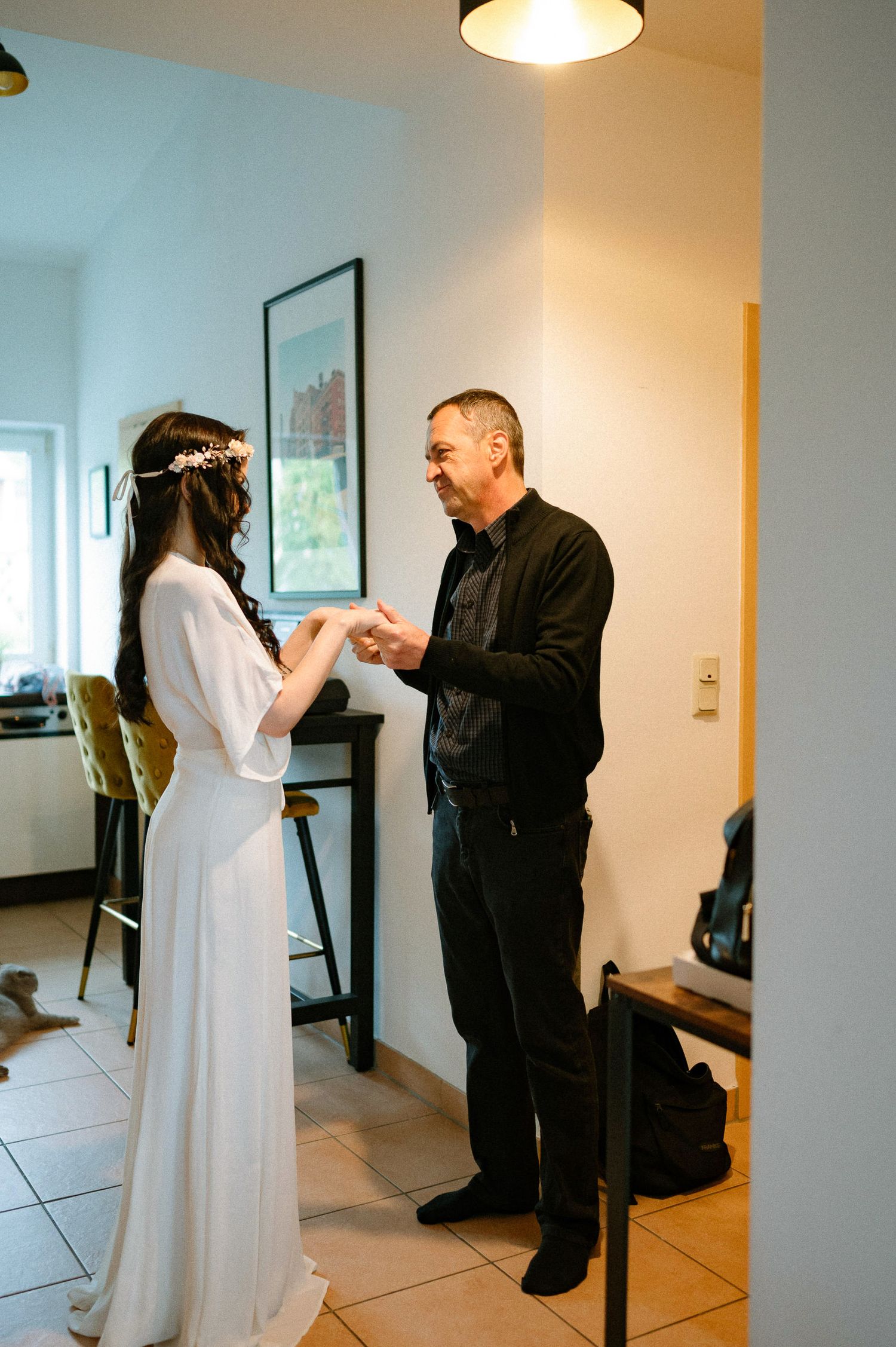 A proposal moment captured in a minimalist room with white walls and natural lighting.