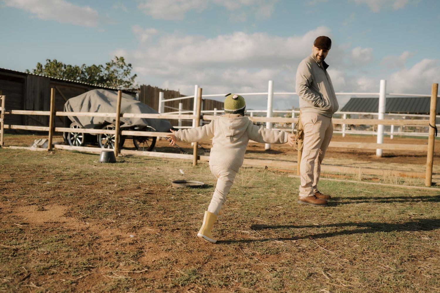 A series of panoramic images showing a horse training session in an outdoor arena with white fencing and natural terrain.