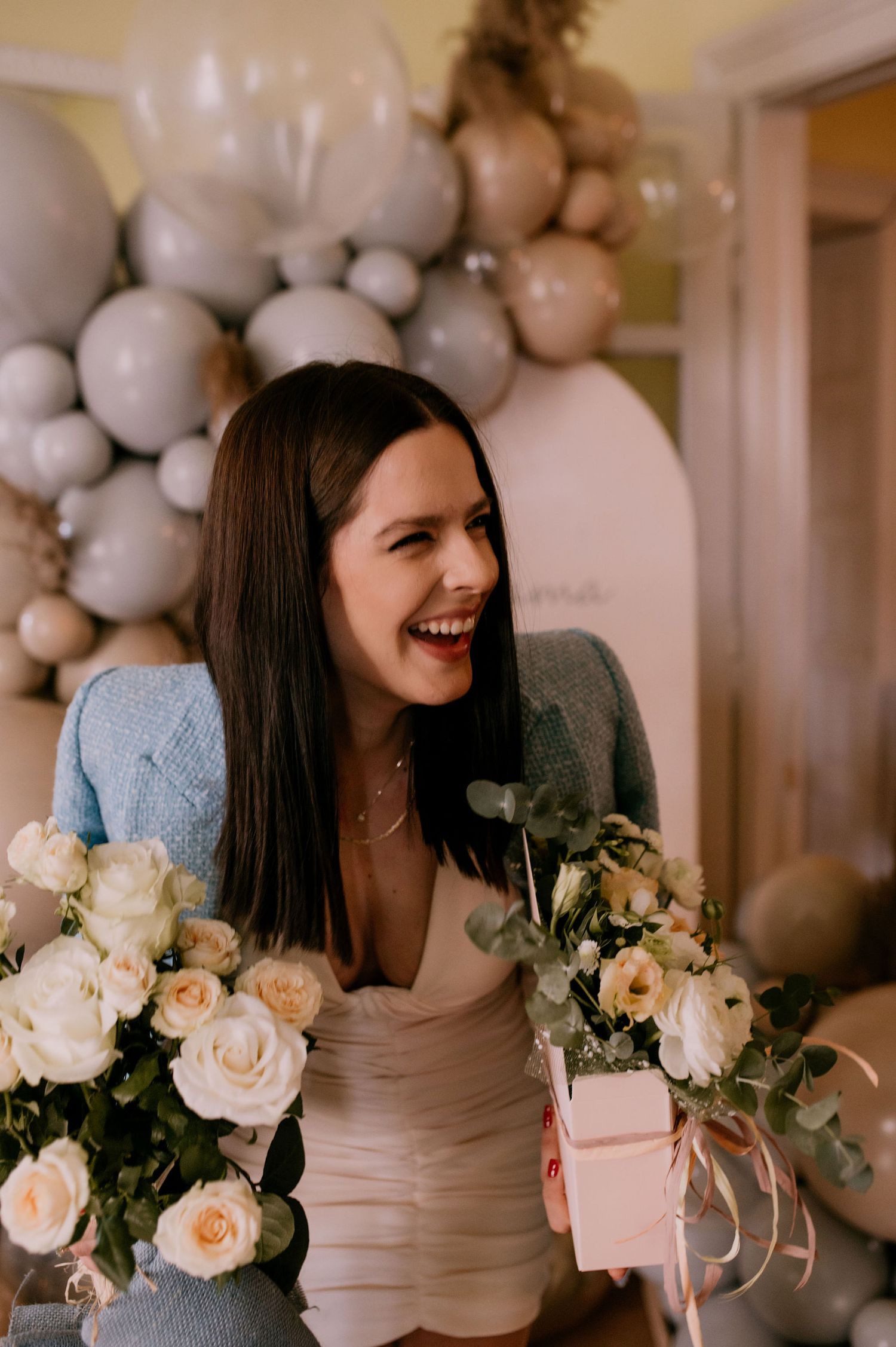 A series of photos showing pink takeout boxes and white roses arranged with gray balloon decorations at an event.