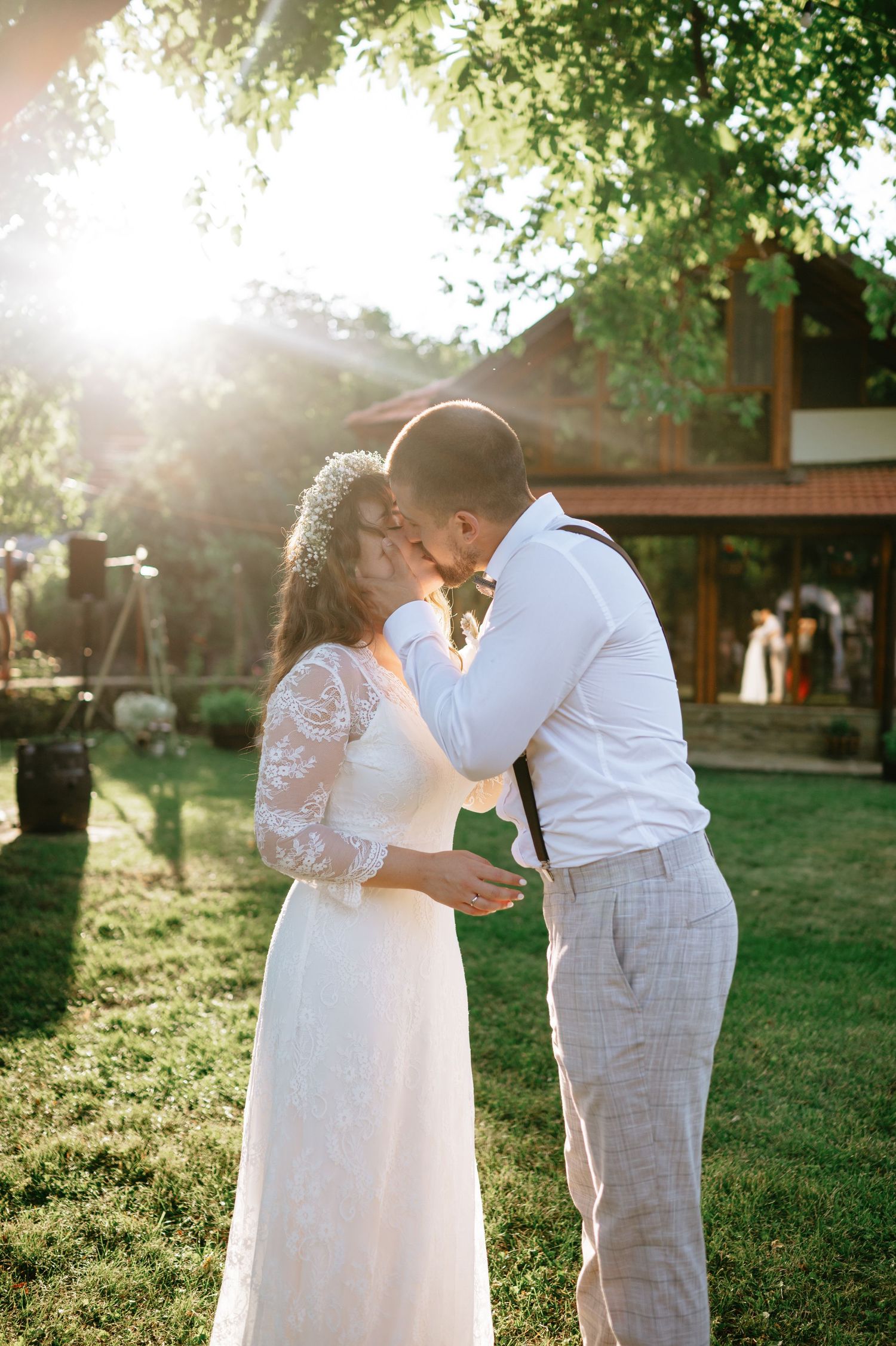 Bride and groom sharing a tender moment during their outdoor wedding ceremony.