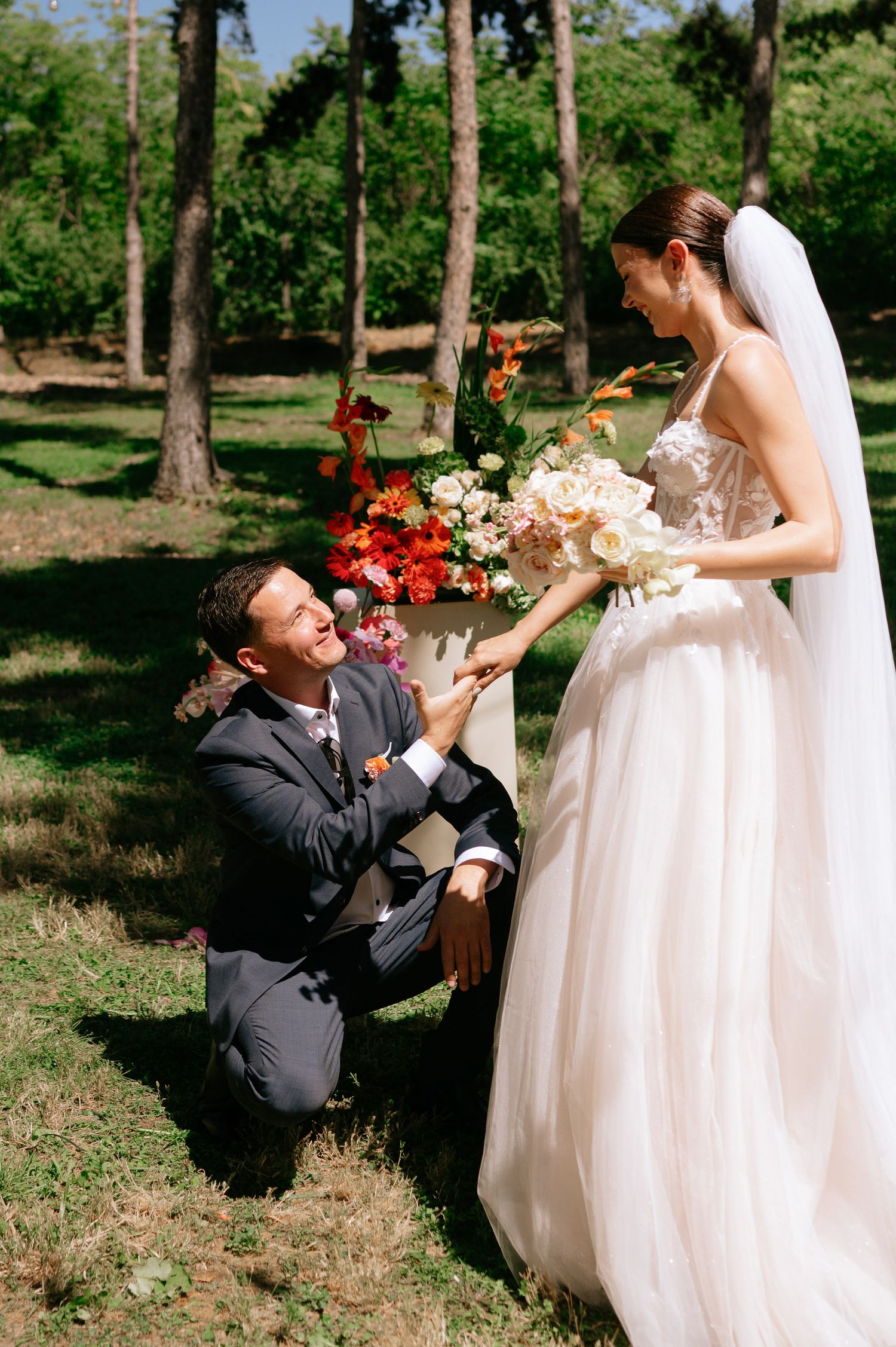 A playful wedding moment captured in a series of photos showing the couple interacting outdoors.