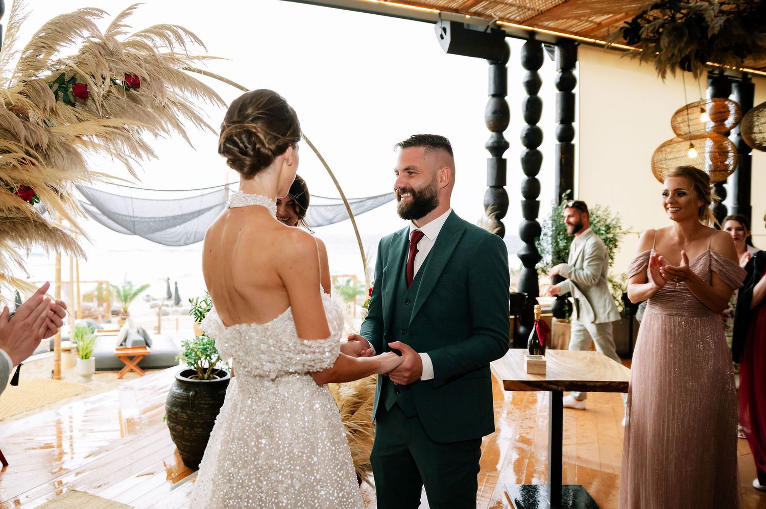 Wedding ceremony setup with modern industrial elements and romantic floral arrangements.