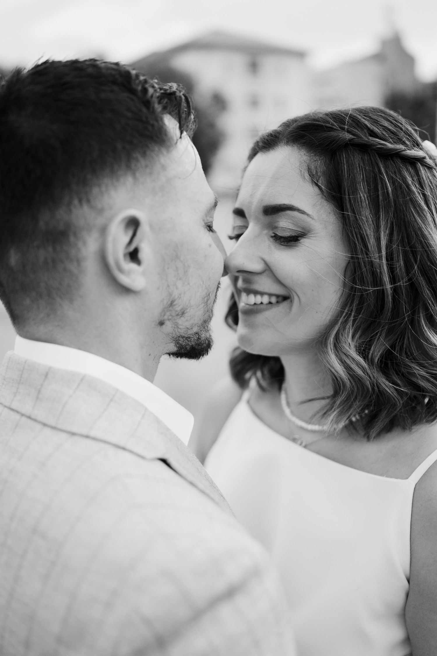 Black and white romantic sequence showing a couple about to kiss in a sweet progression of intimate moments.