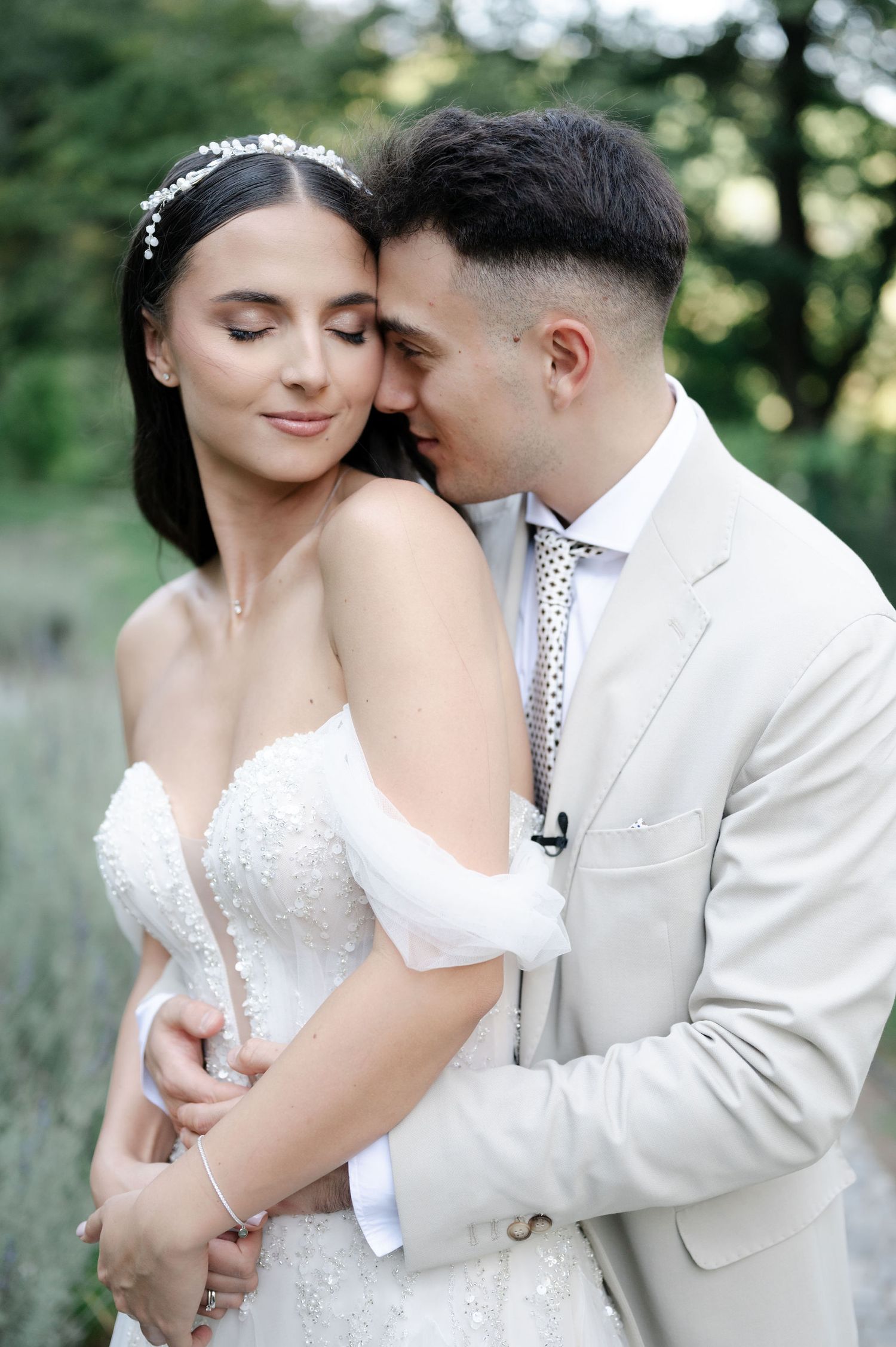 A romantic wedding portrait sequence showing tender moments between a couple in white attire against a natural backdrop.