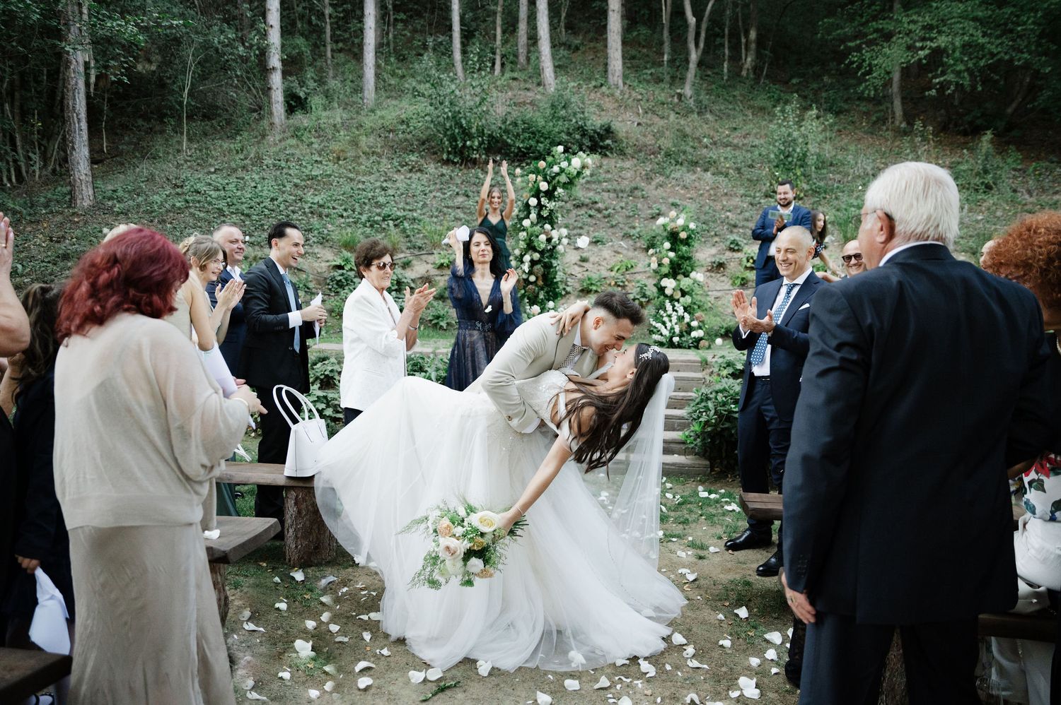 Forest wedding venue features stone steps and natural greenery for an intimate celebration.