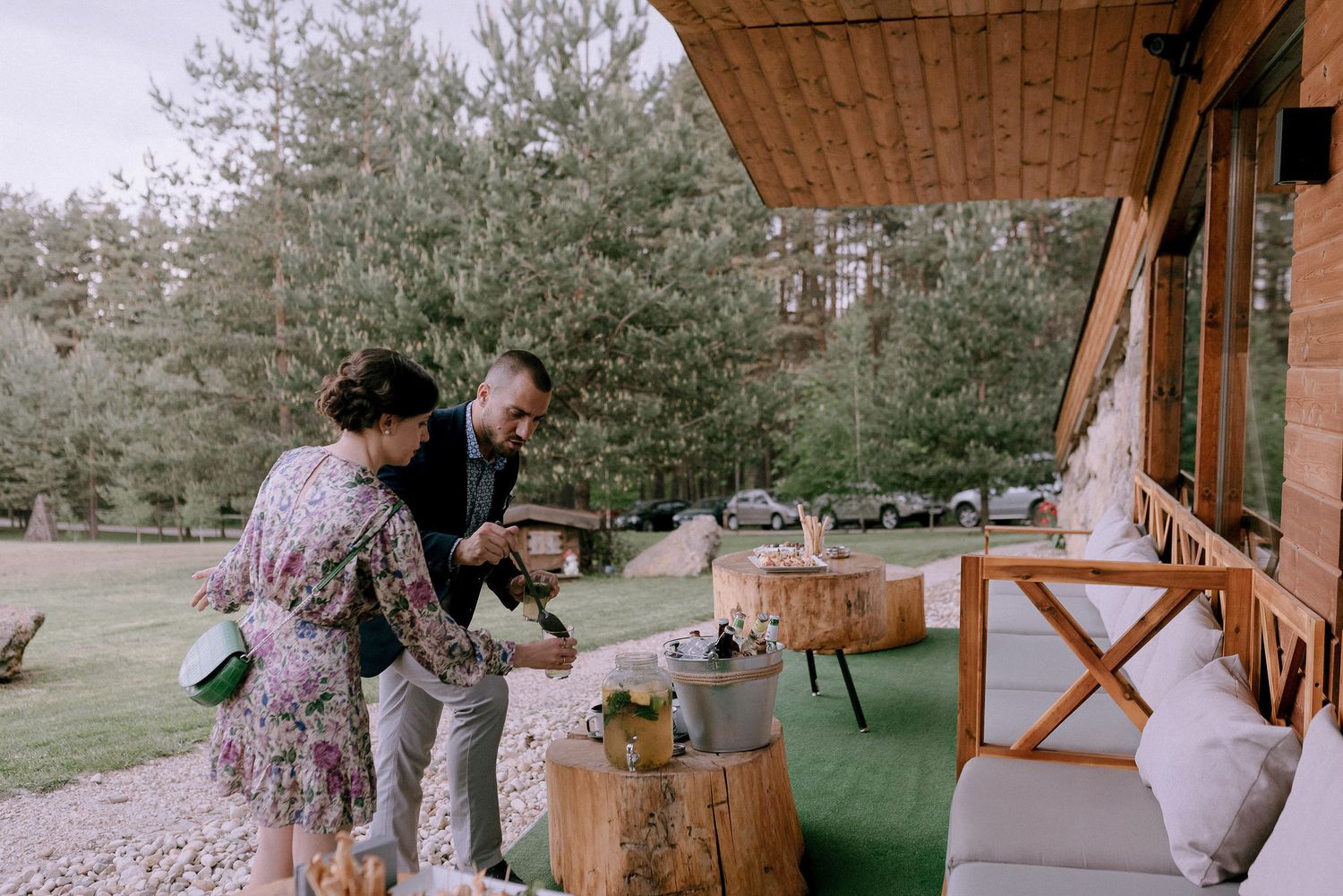 Spring wedding ceremony setup outdoors with cherry blossoms and natural decor.