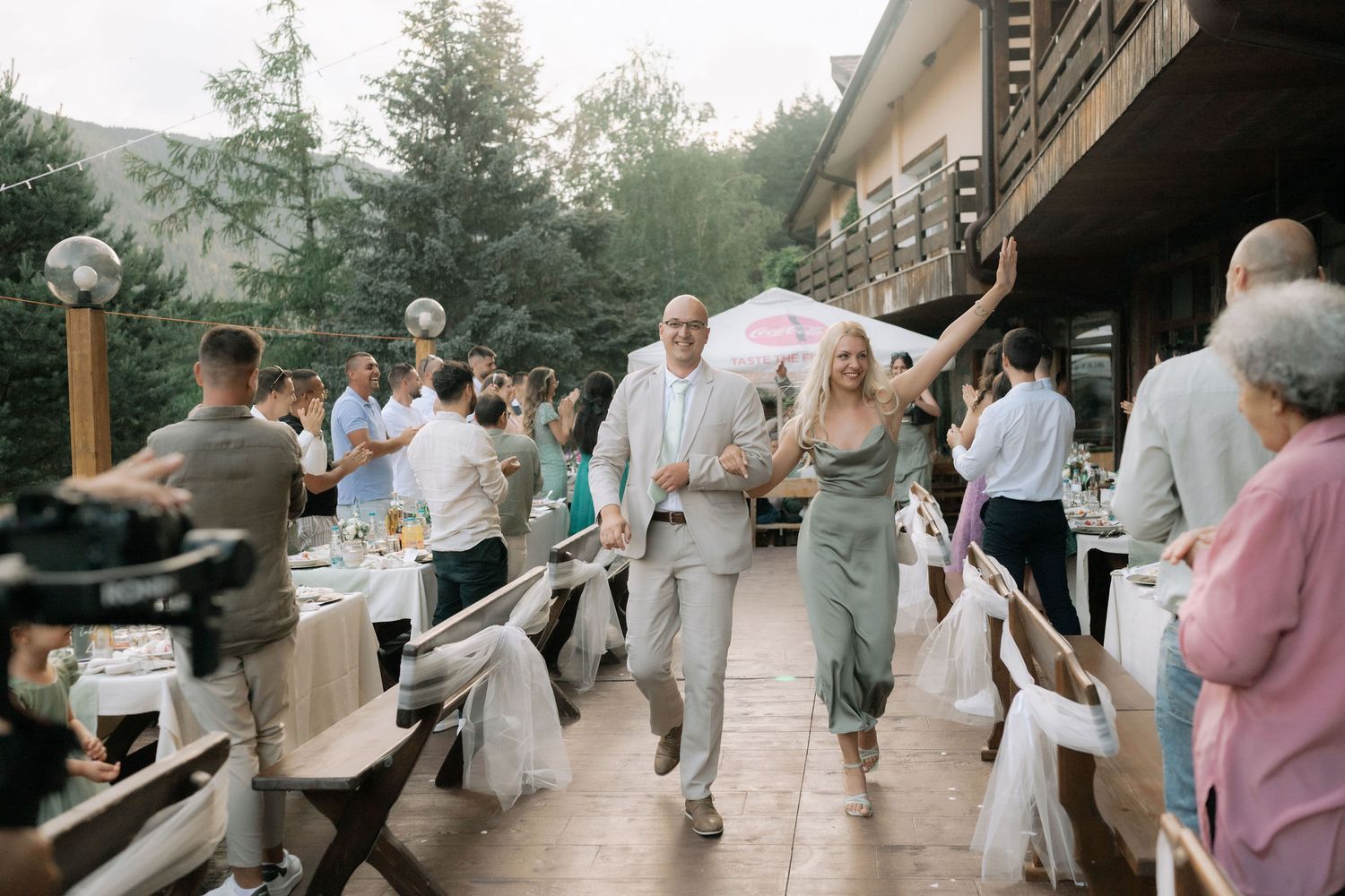 Collage of outdoor wedding celebration moments showing dancing, dining and candid interactions at a rustic venue.