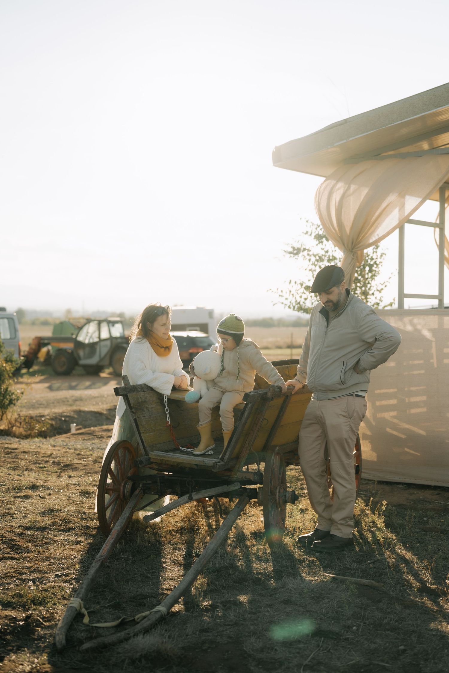 A series of candid outdoor photos showing people relaxing on a wooden bench during golden hour sunset.