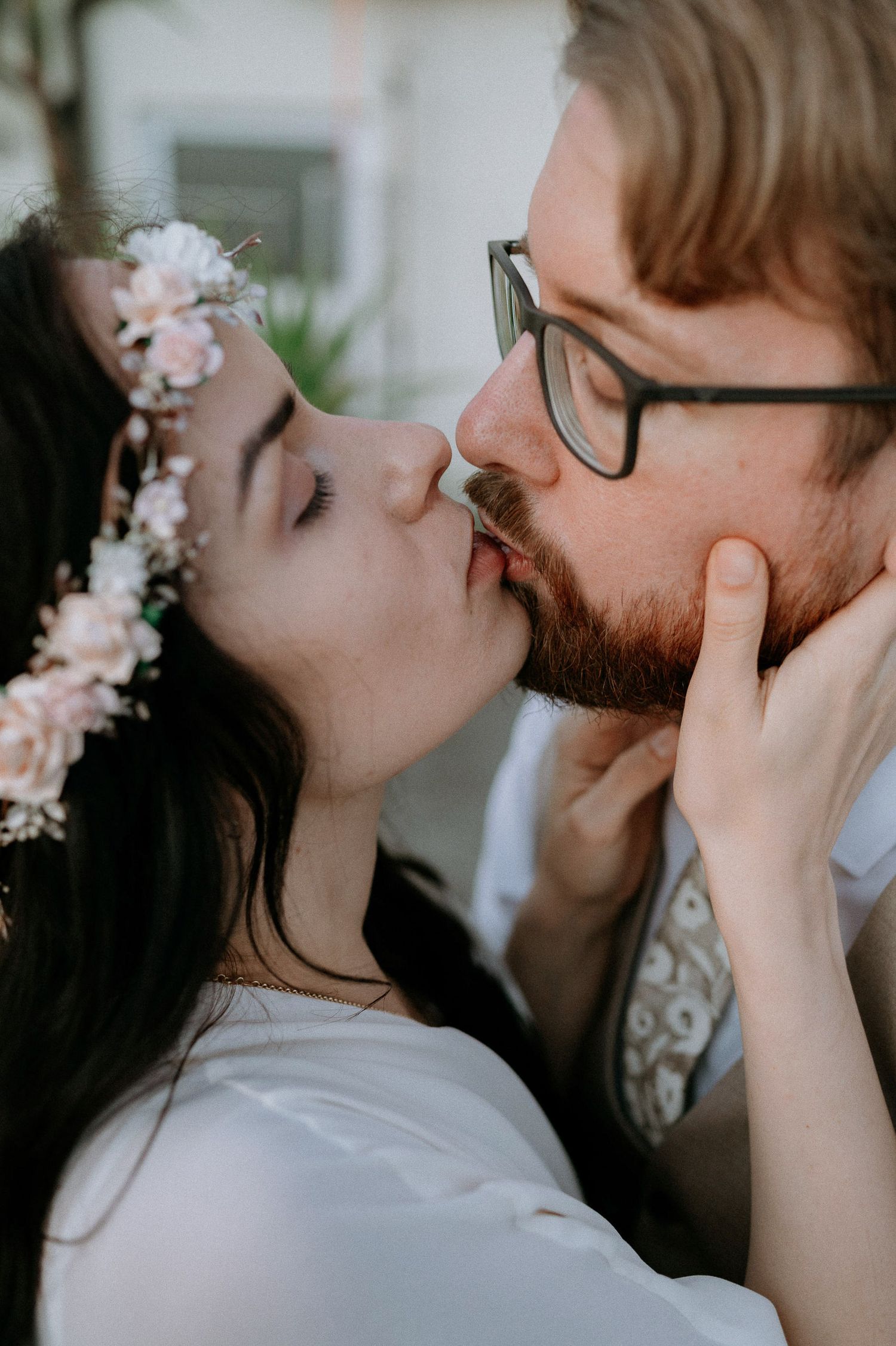 An intimate moment captured in a series of romantic close-up shots with soft lighting.