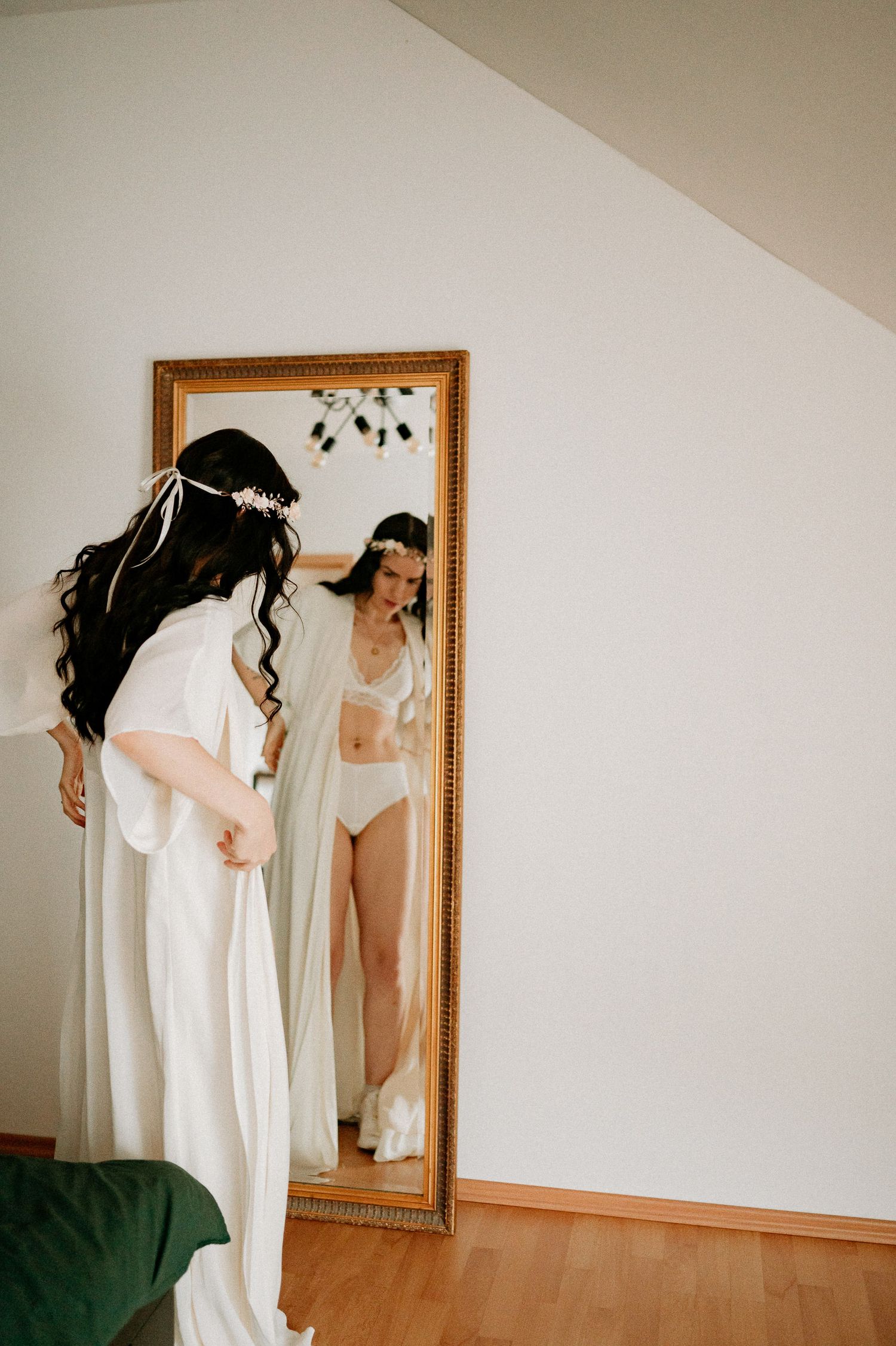 Series showing white fabric movement against a wall with framed mirror.