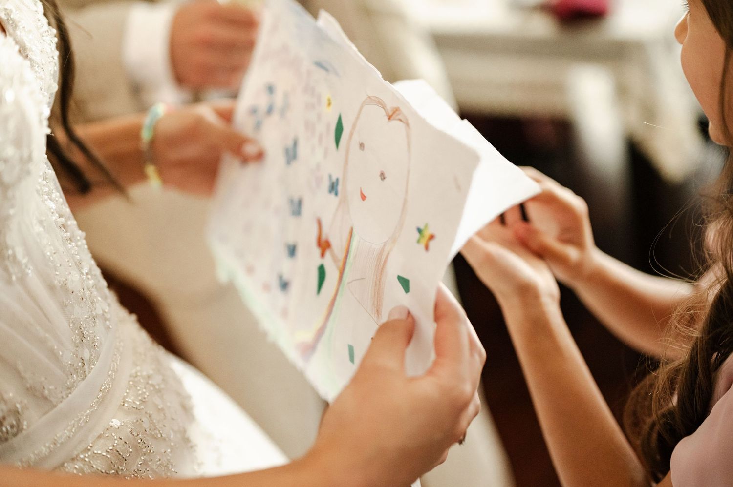 People reading cards or letters during an emotional moment at a celebration.