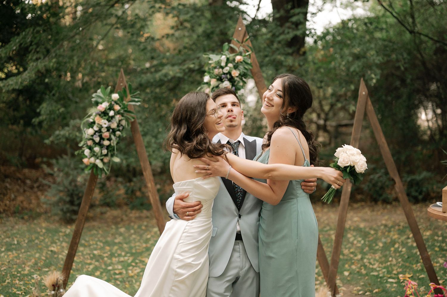 A romantic outdoor wedding photo series showing tender moments between a couple in a natural garden setting.