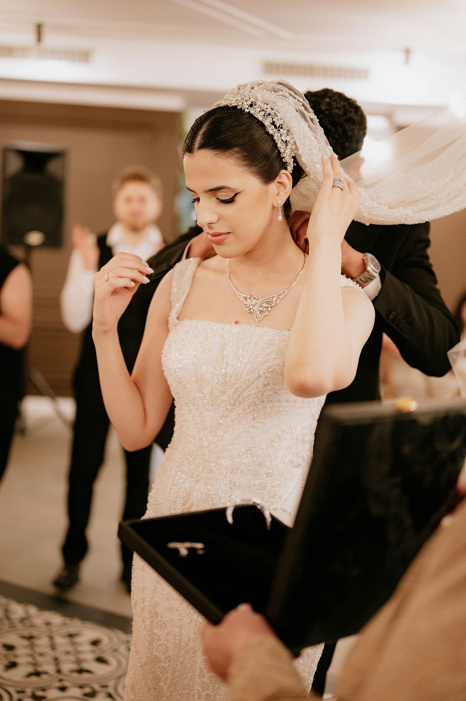Elegant wedding reception dance sequence in formal indoor venue.