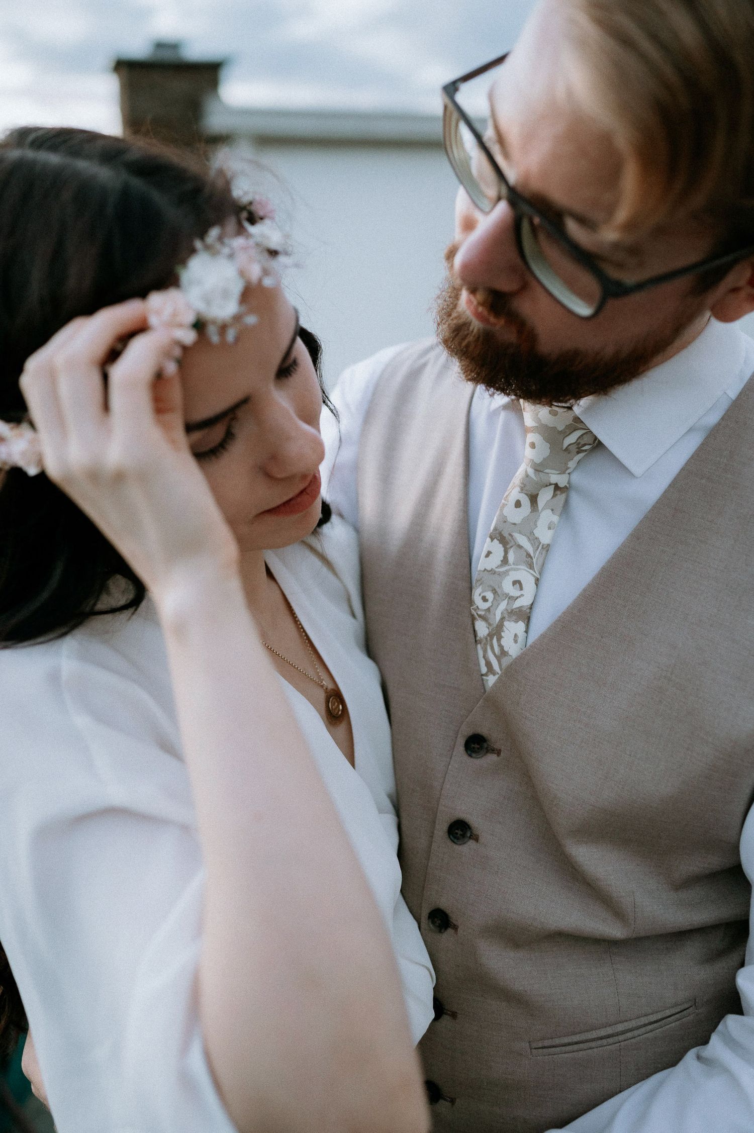 Romantic close-up shots showing tender moments in wedding attire.
