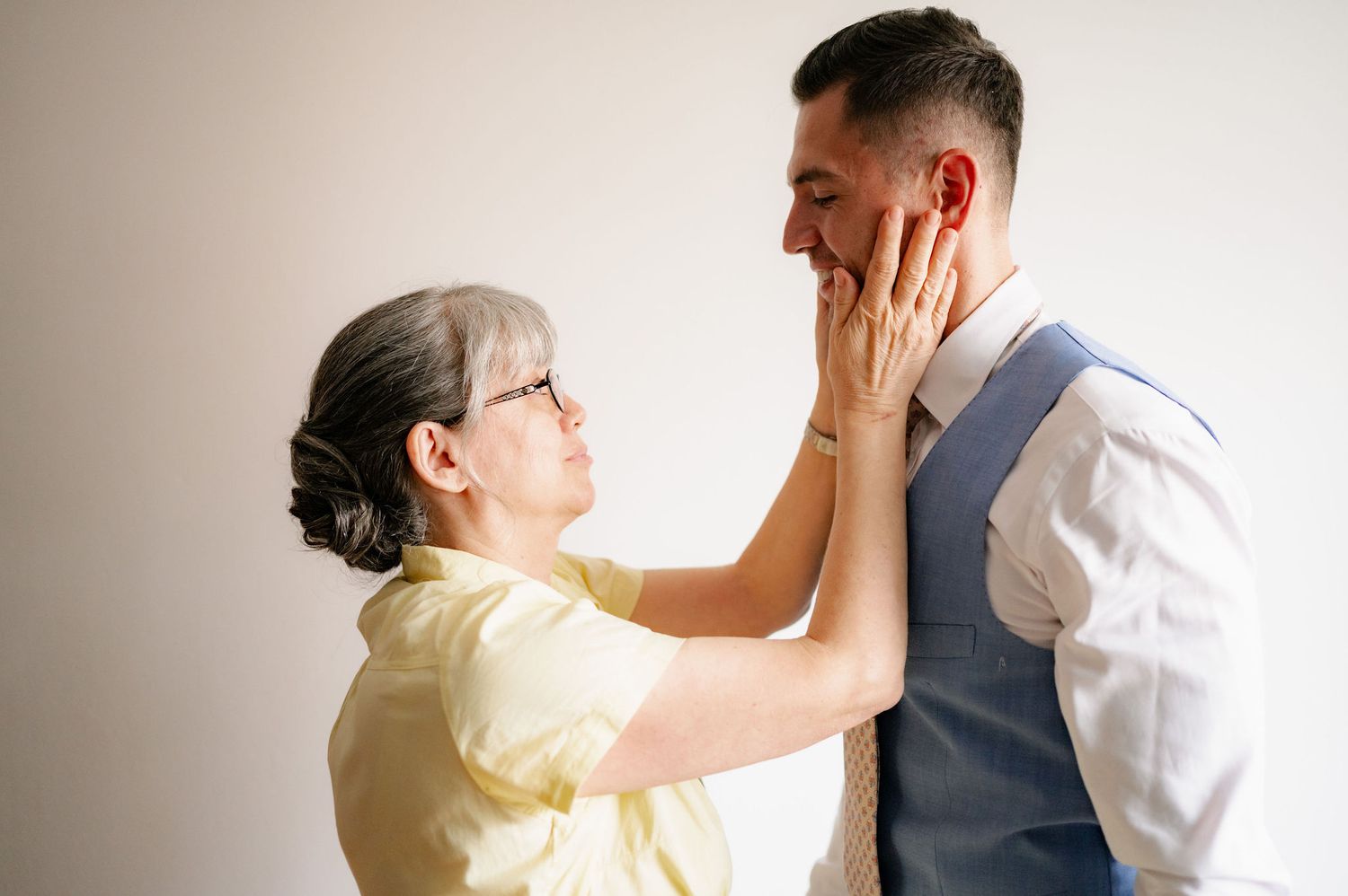 A series of candid emotional moments captured in a light-filled studio setting.
