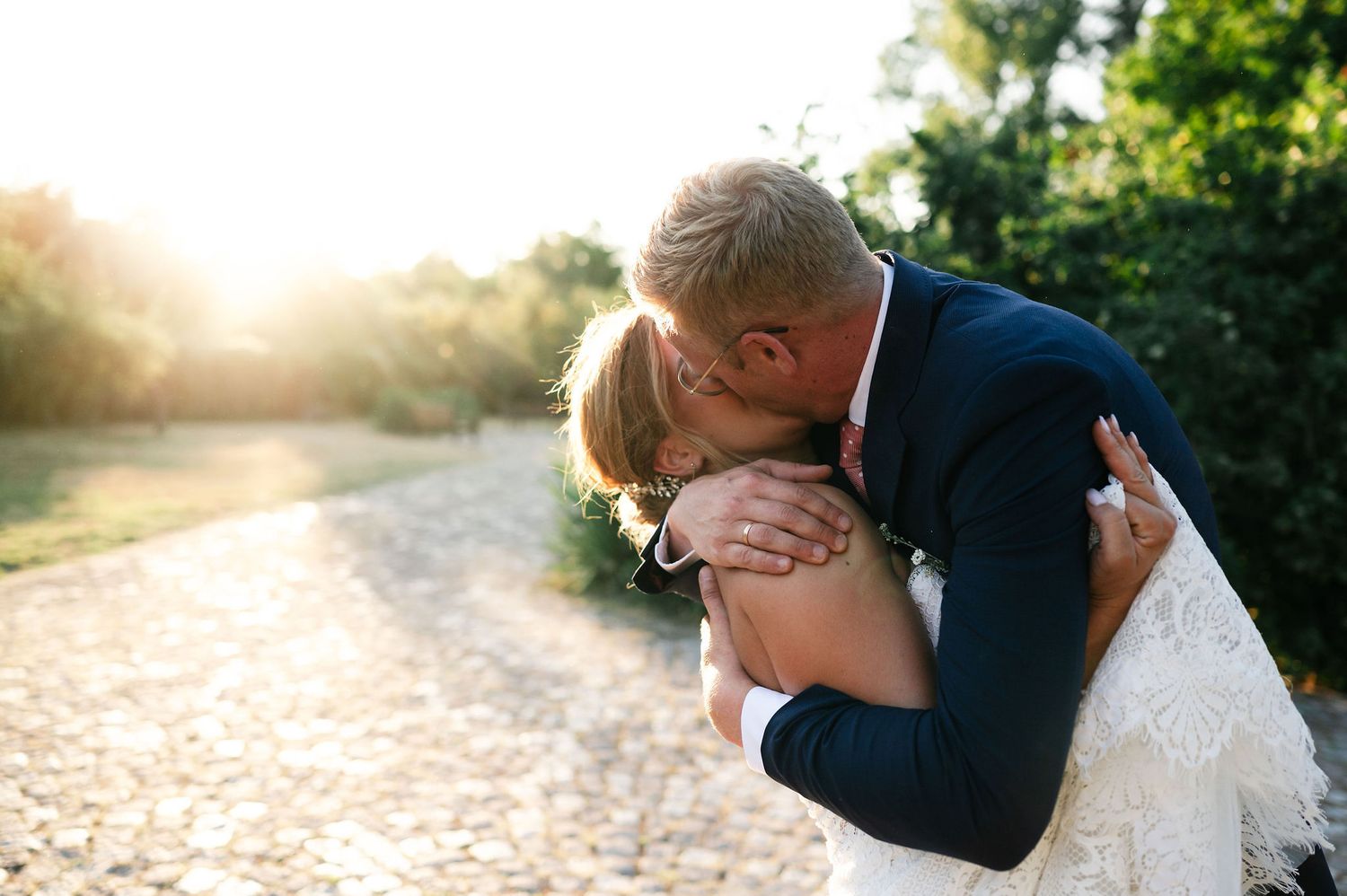 Romantic wedding photography sequence captured during golden hour.