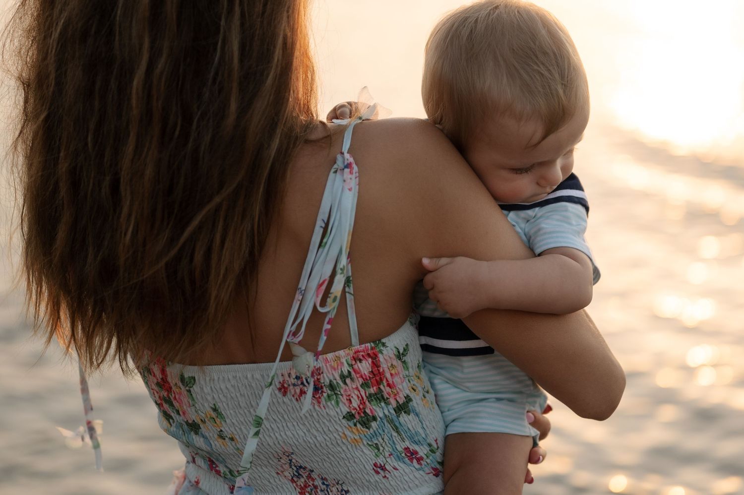 A collage of tender family moments captured in warm sunlight showing embraces and gentle interactions.