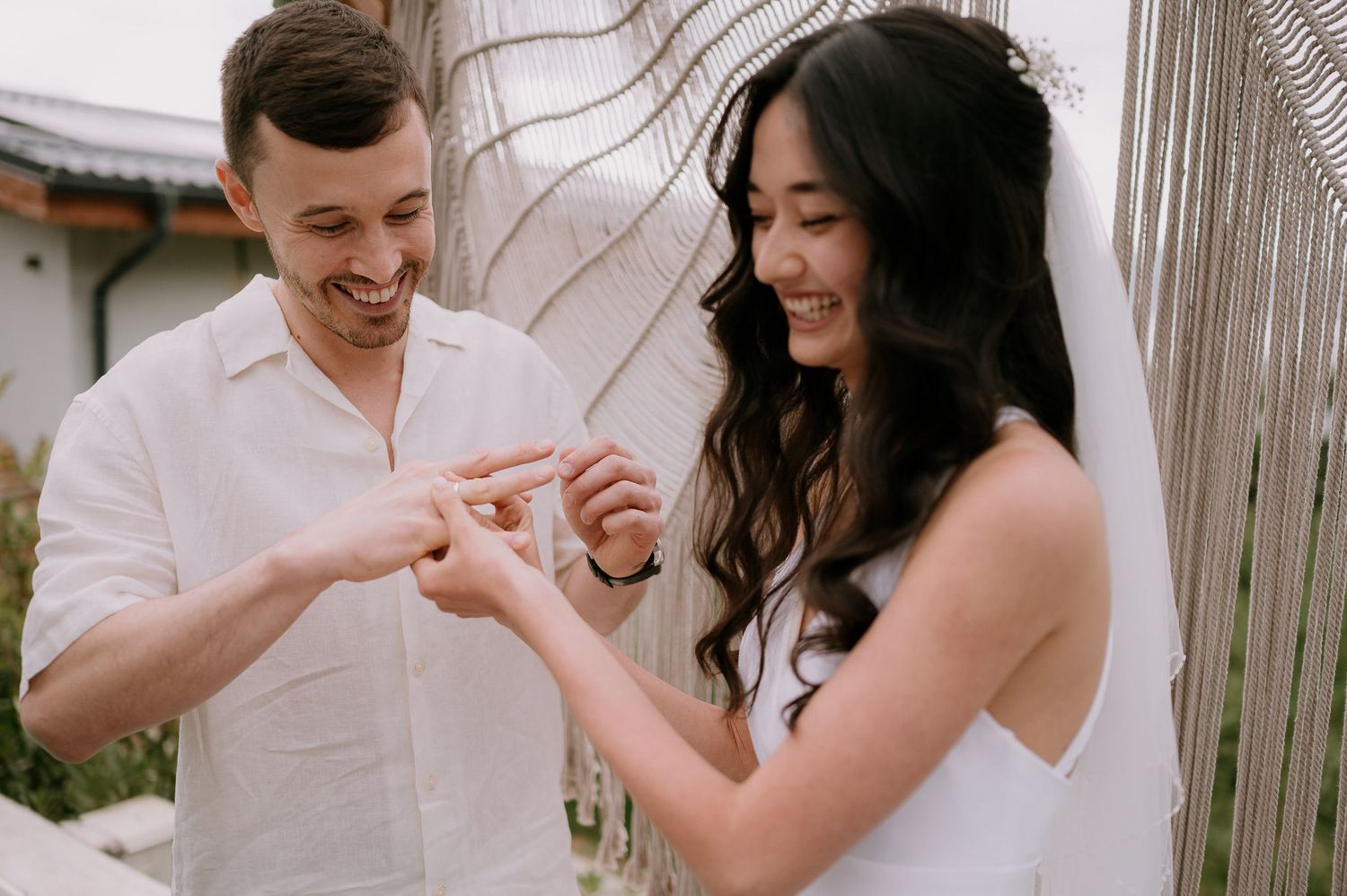 Happy interaction between couple during outdoor pool celebration.