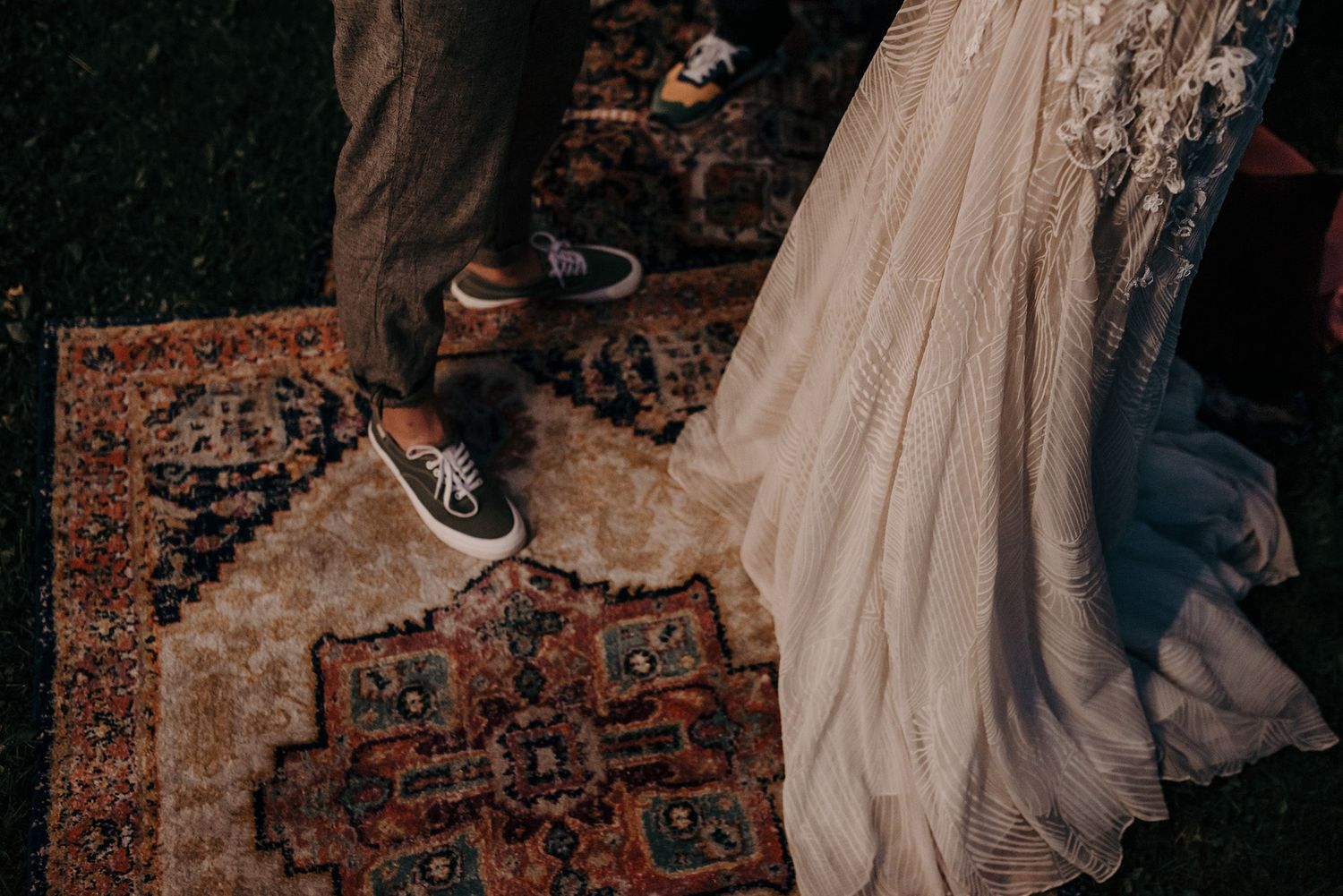 A collection of vintage rugs and decor items arranged in a bohemian style setting with warm lighting and rustic elements.