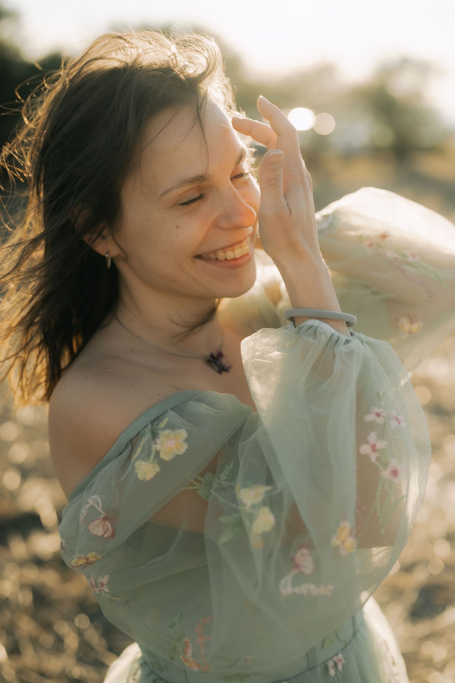 Ethereal portrait series in mint green floral dress captures dreamy sunlit moments at golden hour.