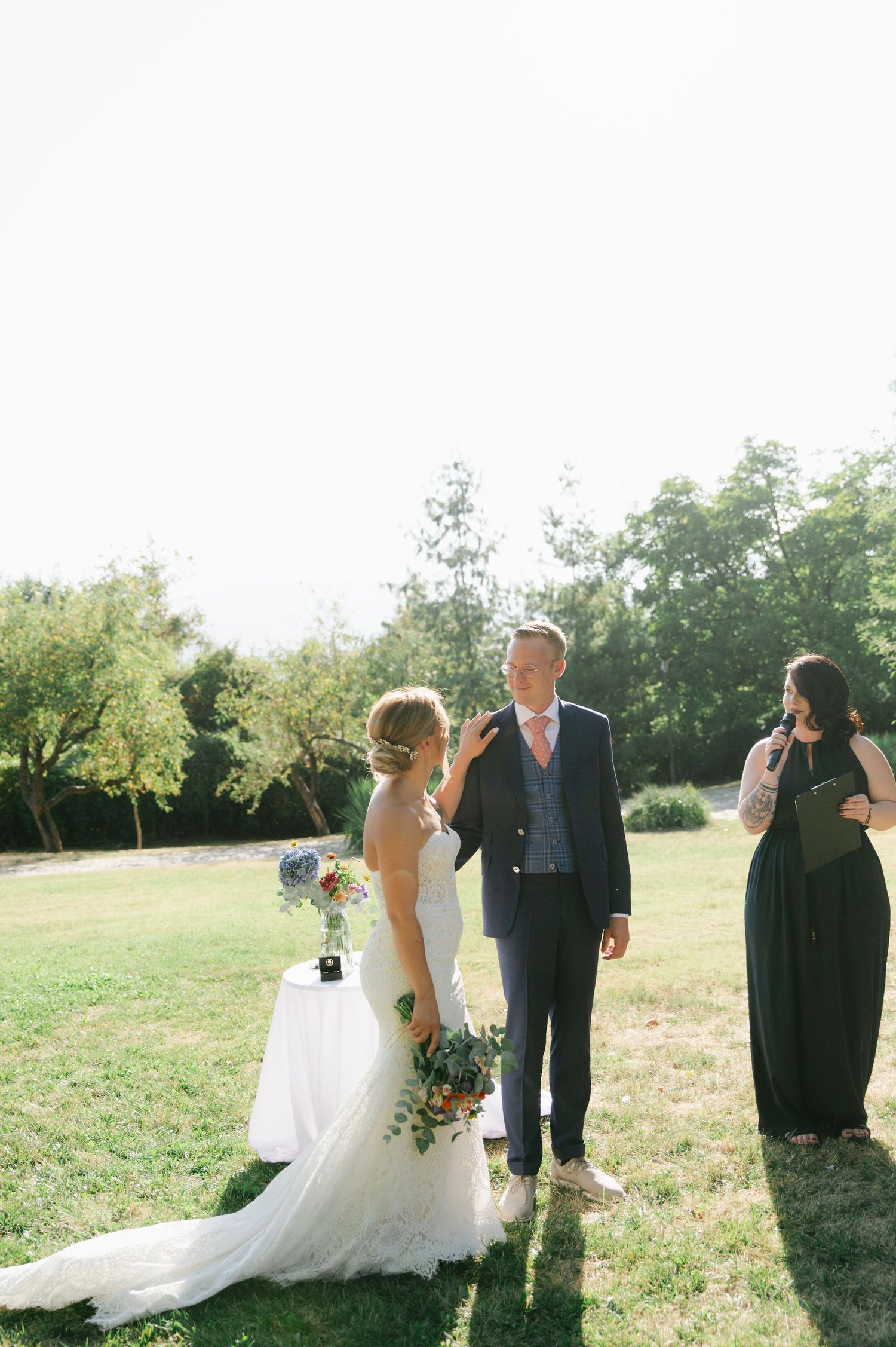 A series of candid moments during an outdoor wedding ceremony with natural sunlight.