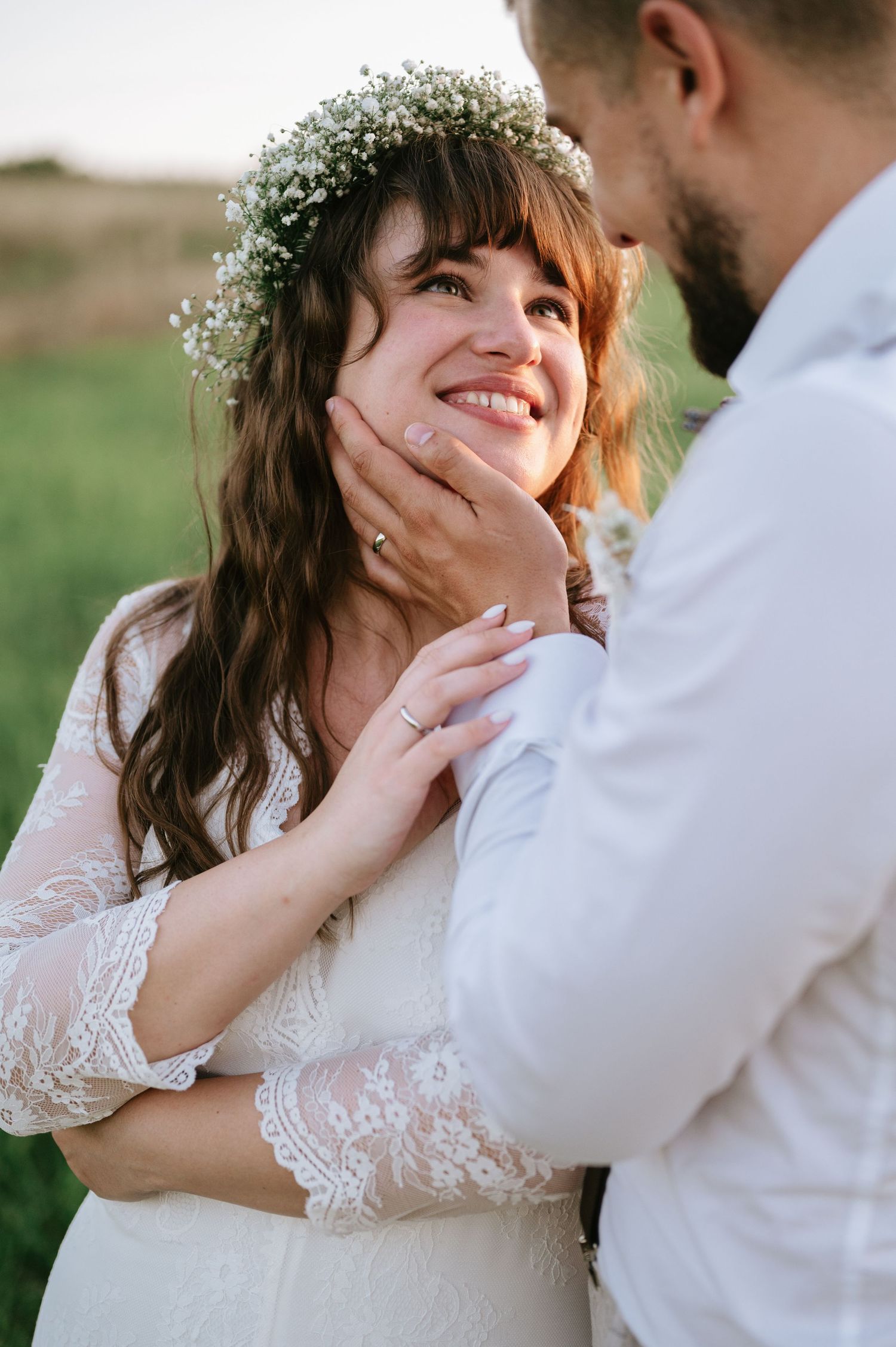 Romantic close-up shots of newlyweds sharing gentle touches and loving gazes.