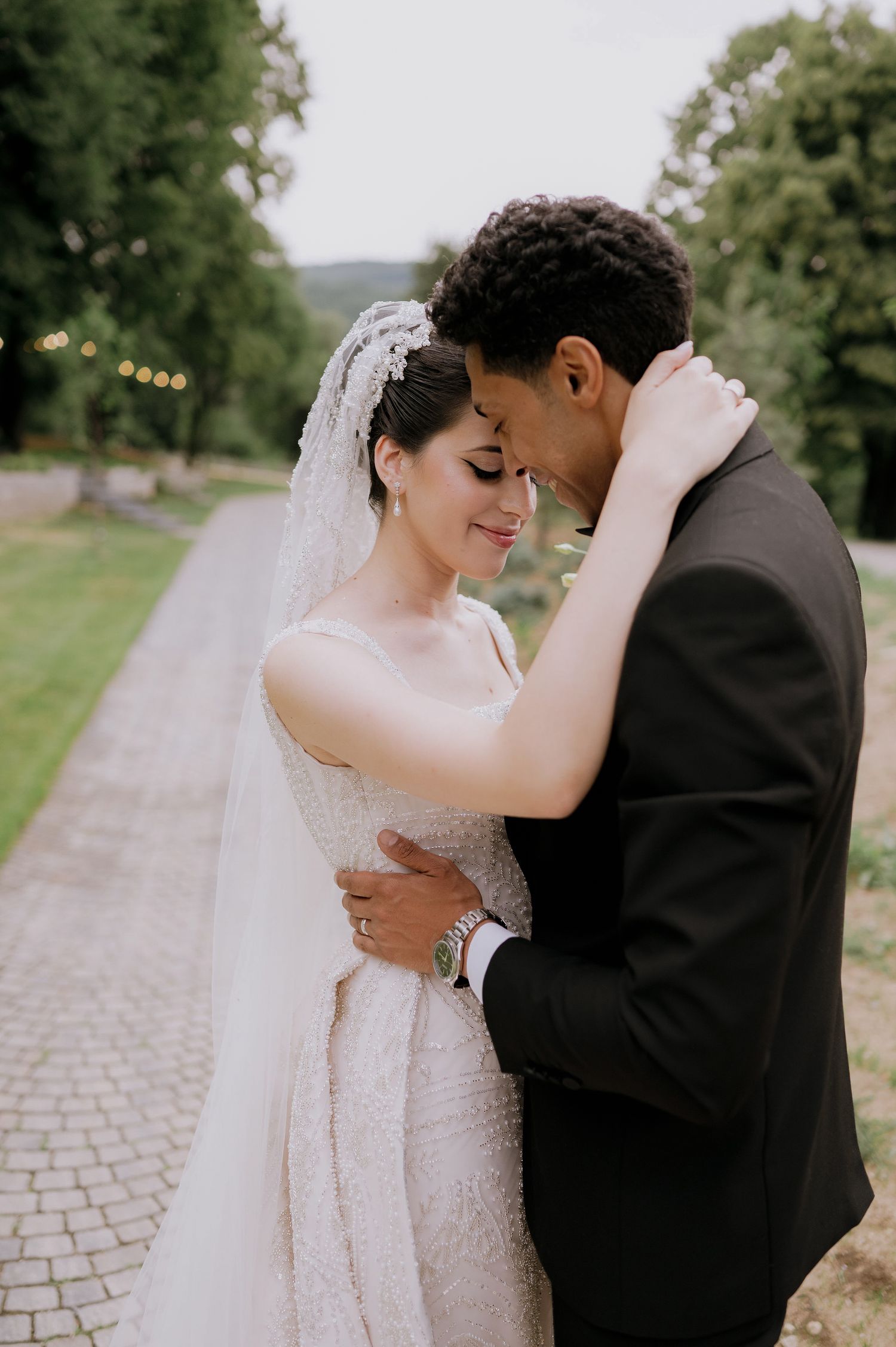 An intimate embrace between newlyweds during their wedding photoshoot.