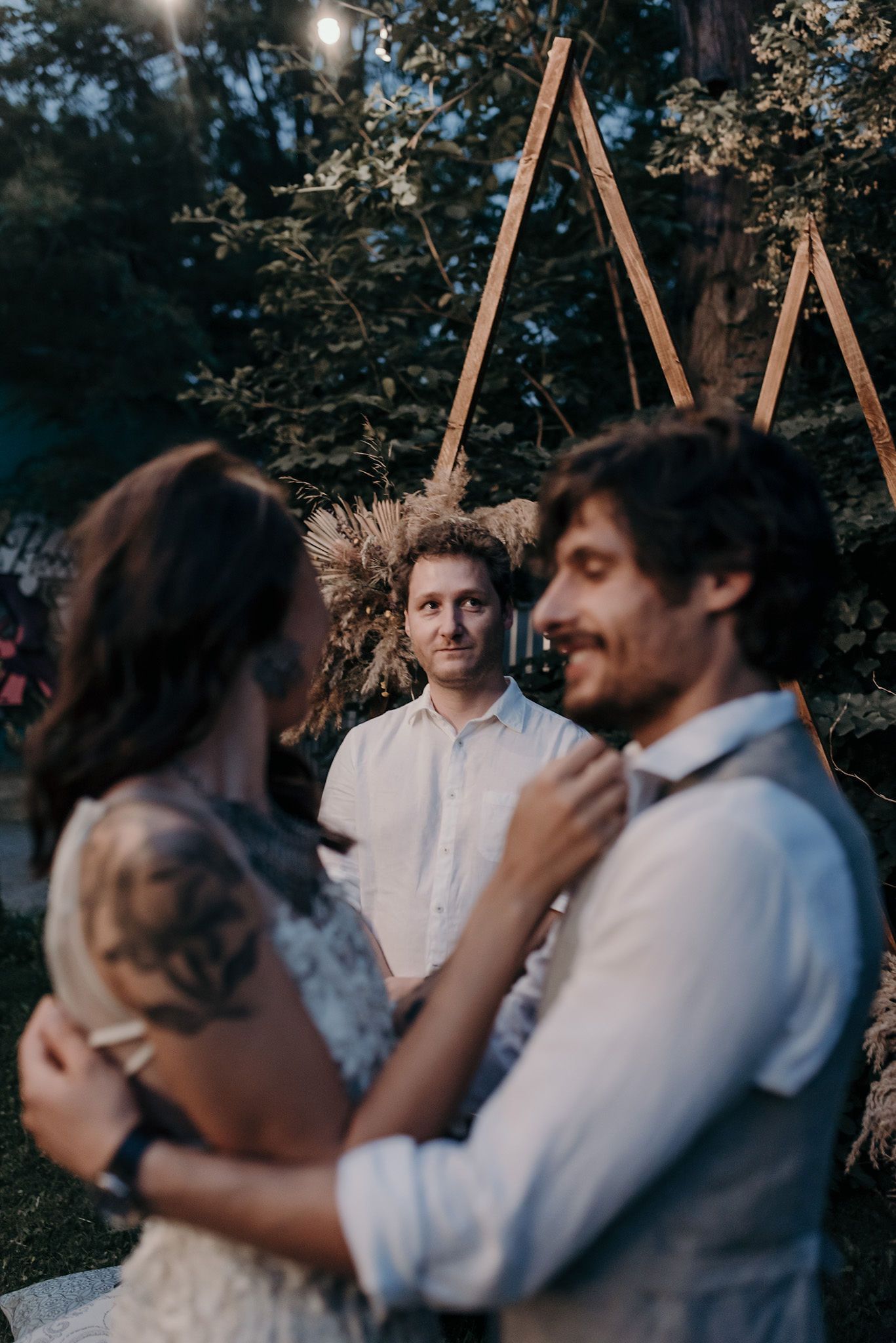 Candid outdoor photography sequence showing emotional interaction in evening light.