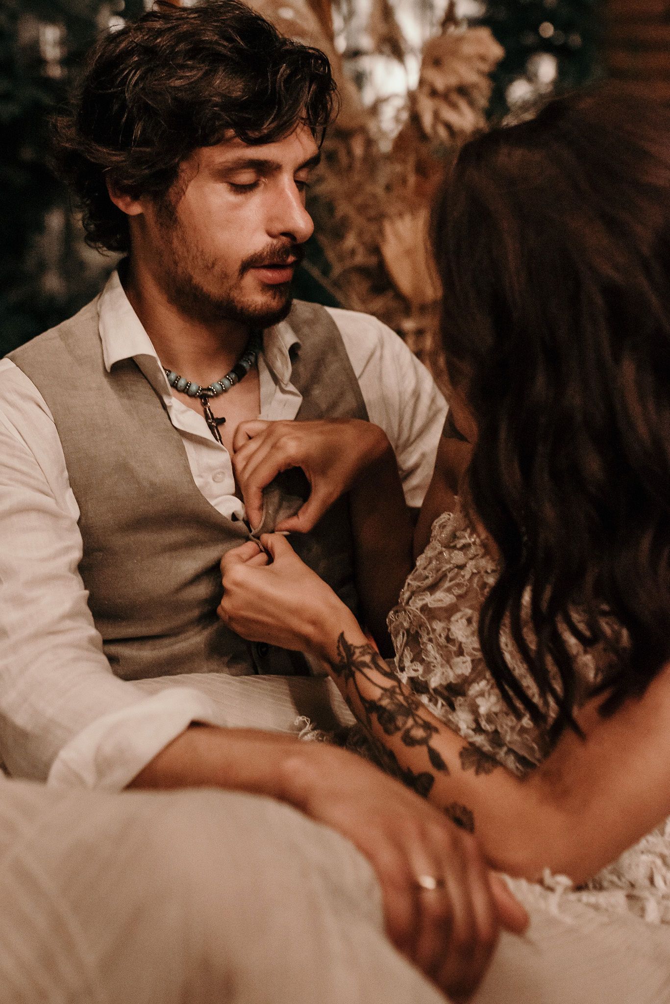 Intimate wedding couple shares tender moments in a series of romantic sepia-toned photographs.