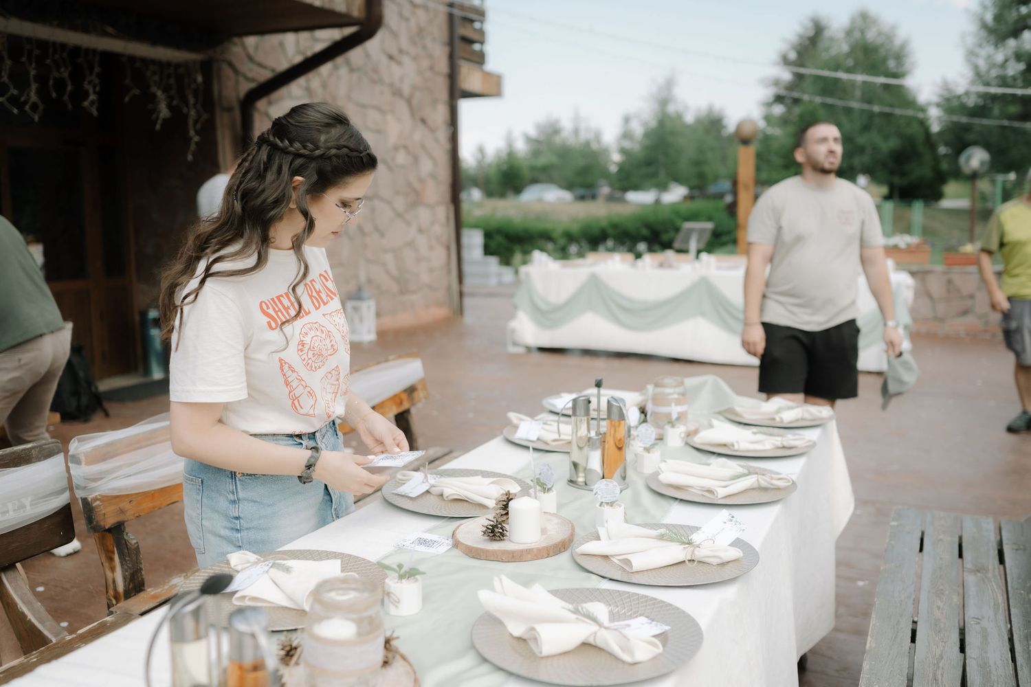 A series of casual outdoor dining scenes with table settings and plates arranged on wooden tables at a summer gathering.