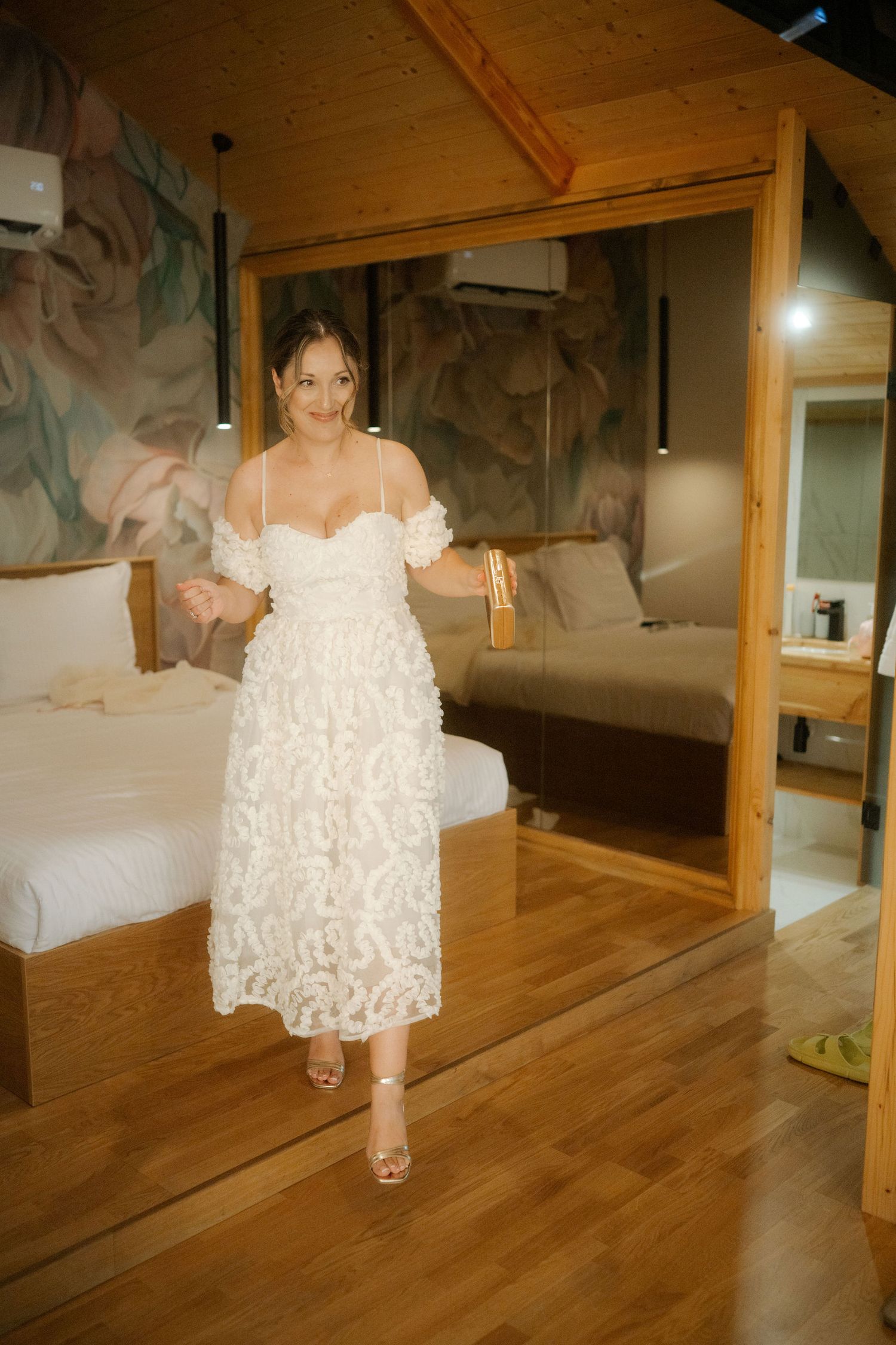 A series of photos showing a white ruffled dress twirling on a wooden floor in an indoor setting.