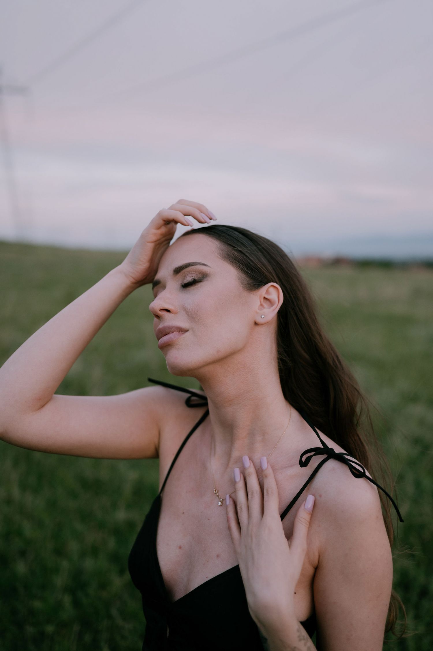 Artistic portrait series of a woman in black top posing expressively against a natural outdoor backdrop at sunset.