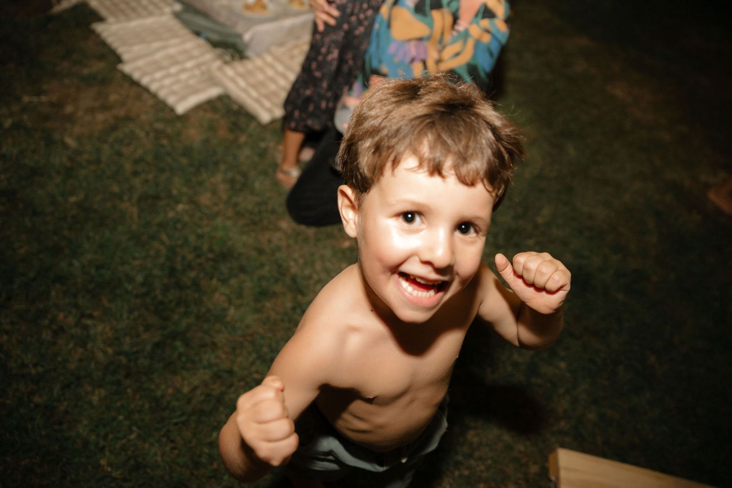 A series of playful candid photos showing joyful expressions and laughter in an outdoor setting.