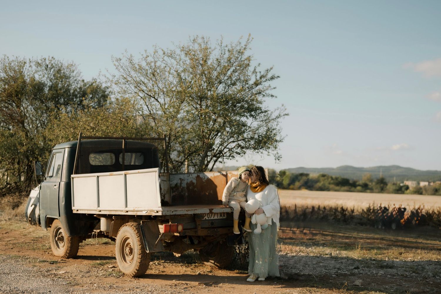 A series of vintage photographs showing a pickup truck parked in a rural landscape during harvest season.