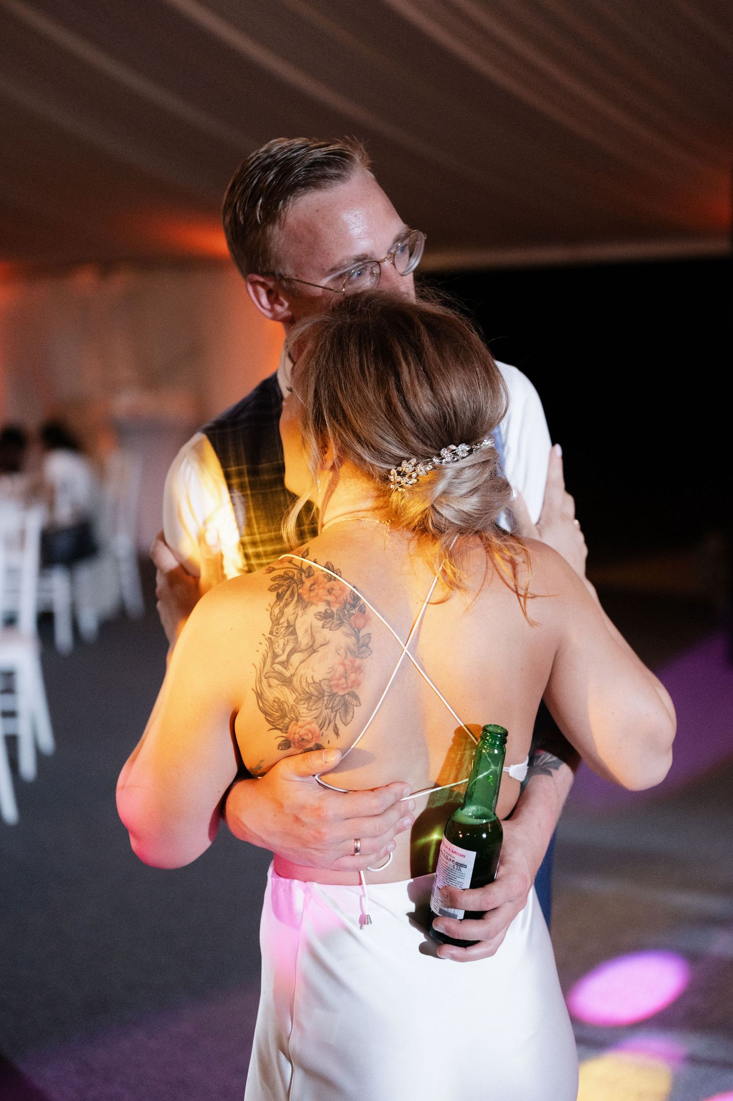 A sequence of dance floor moments showing a person in a white top holding a beer bottle at a party with warm lighting.