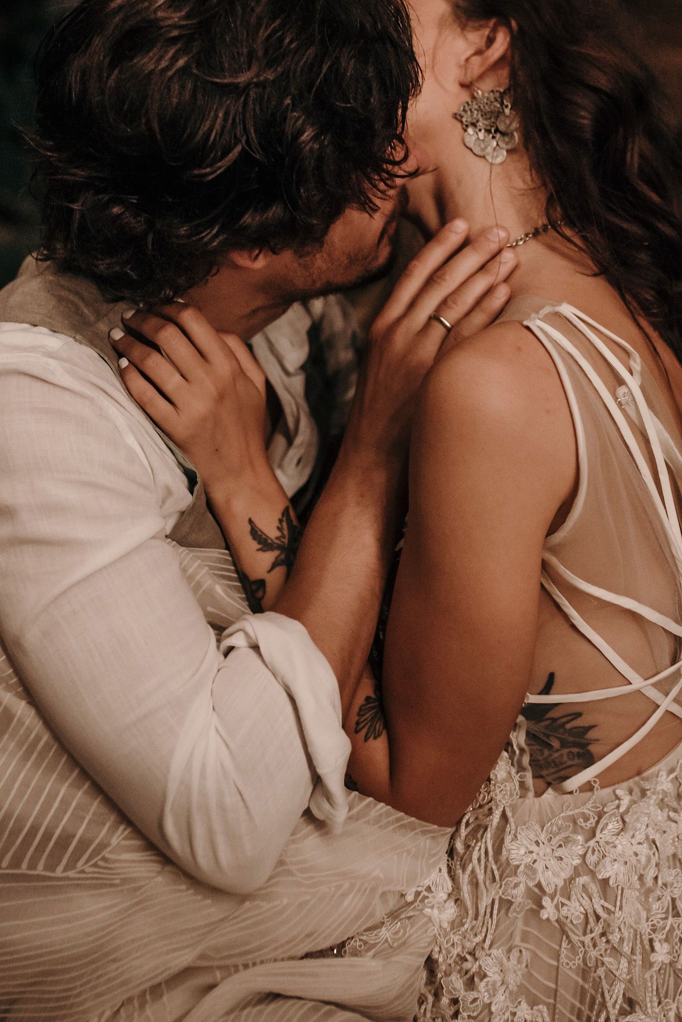 Intimate close-up series of a couple in white embracing and sharing tender moments together.